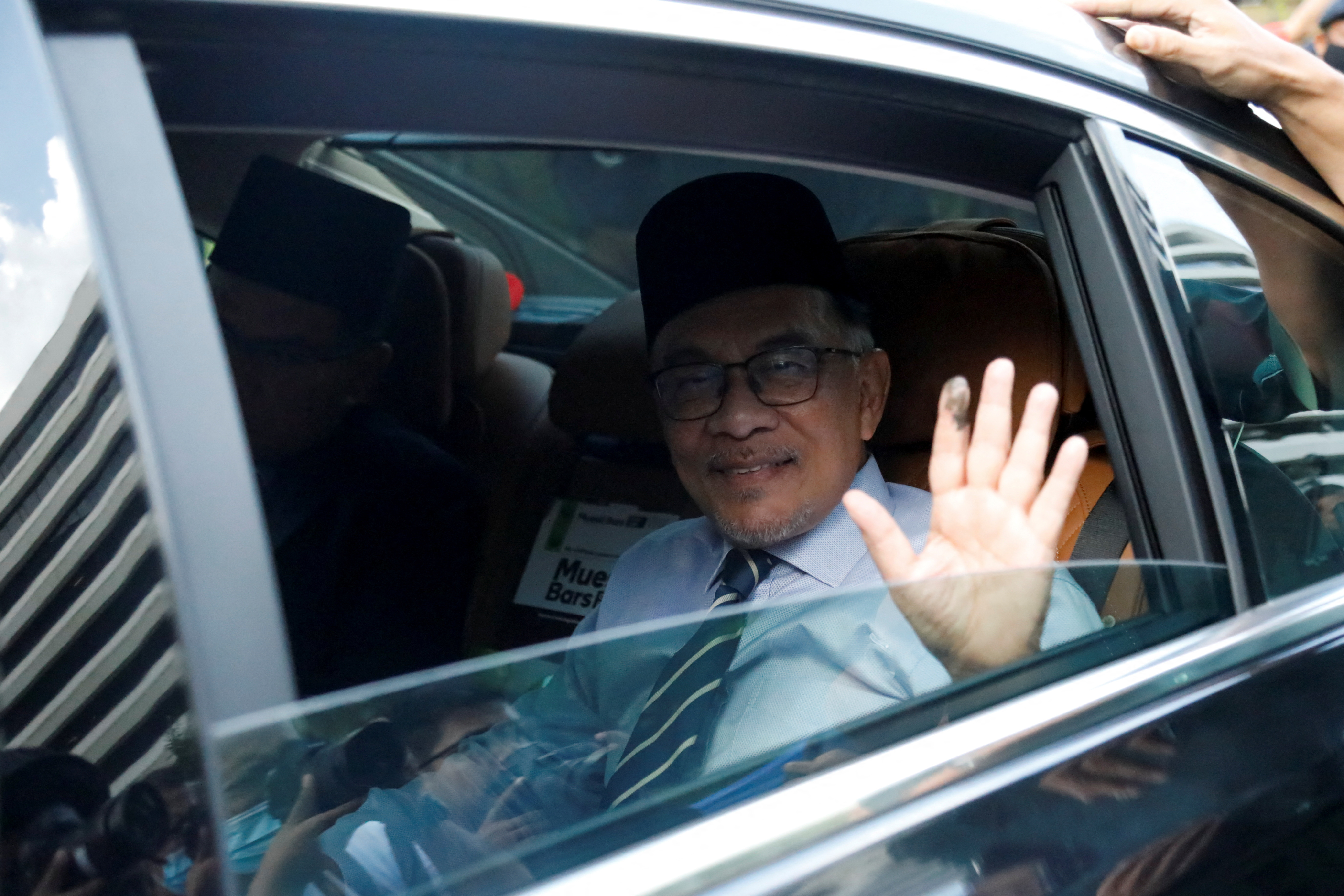Malaysia's opposition leader Anwar Ibrahim arrives at the National Palace, in Kuala Lumpur