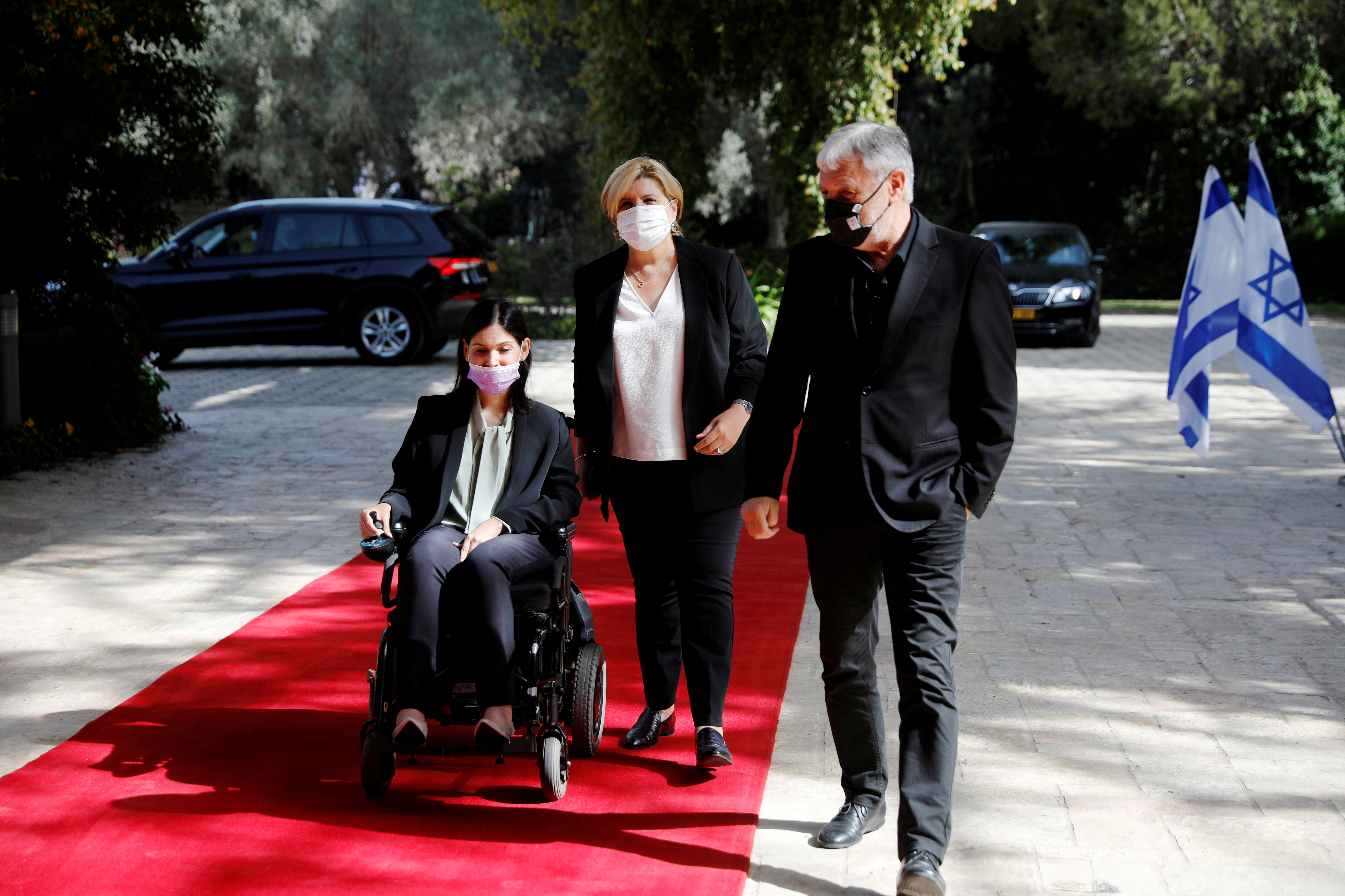 Karine Elharrar, Orna Barbivai and Meir Cohen from the Yesh Atid party arrive for consultations on the formation of a coalition government, at the President's residence in Jerusalem April 5, 2021. REUTERS/Amir Cohen/File Photo