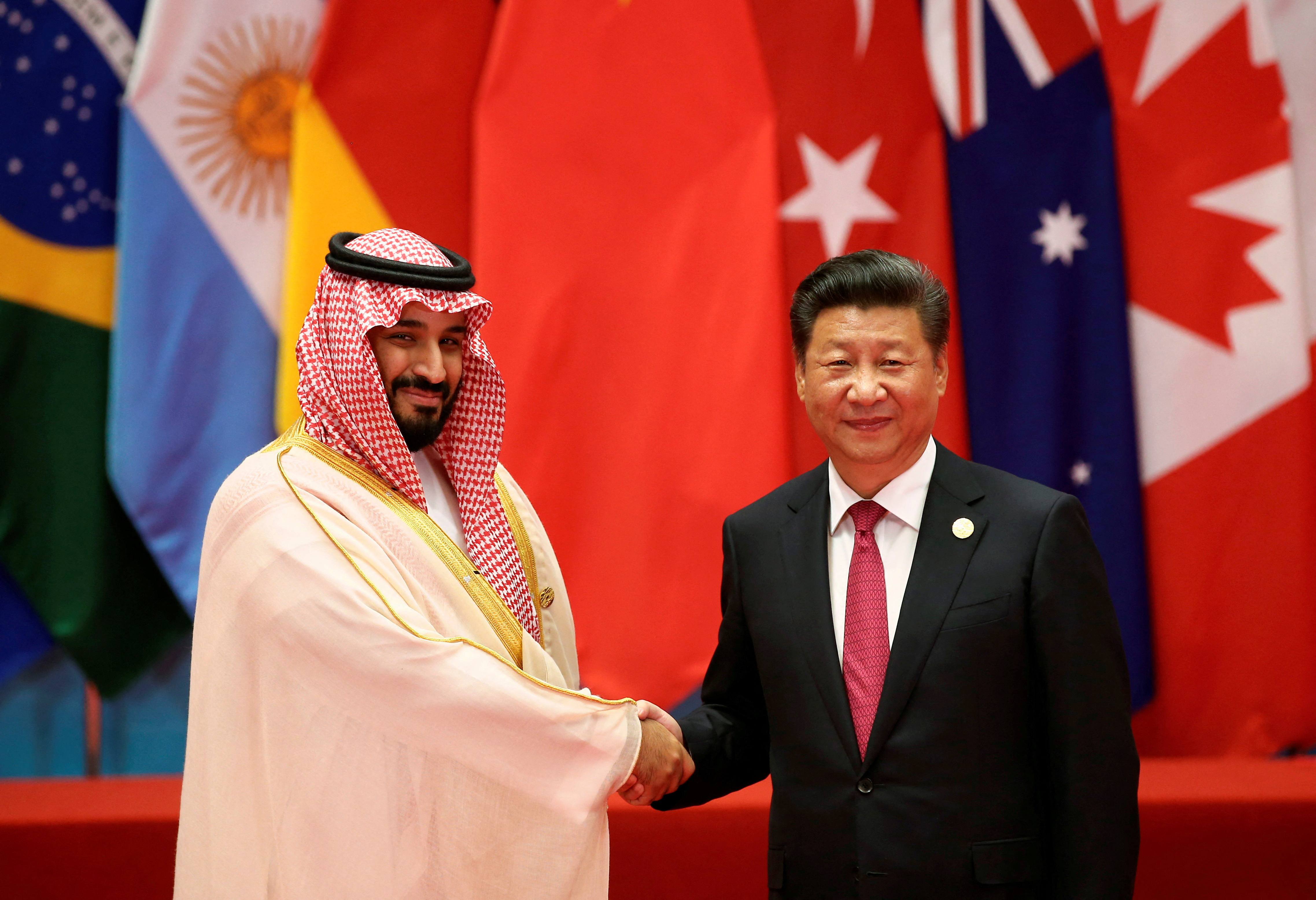 Chinese President Xi Jinping shakes hands with Saudi Arabia's Deputy Crown Prince Mohammed bin Salman during the G20 Summit in Hangzhou