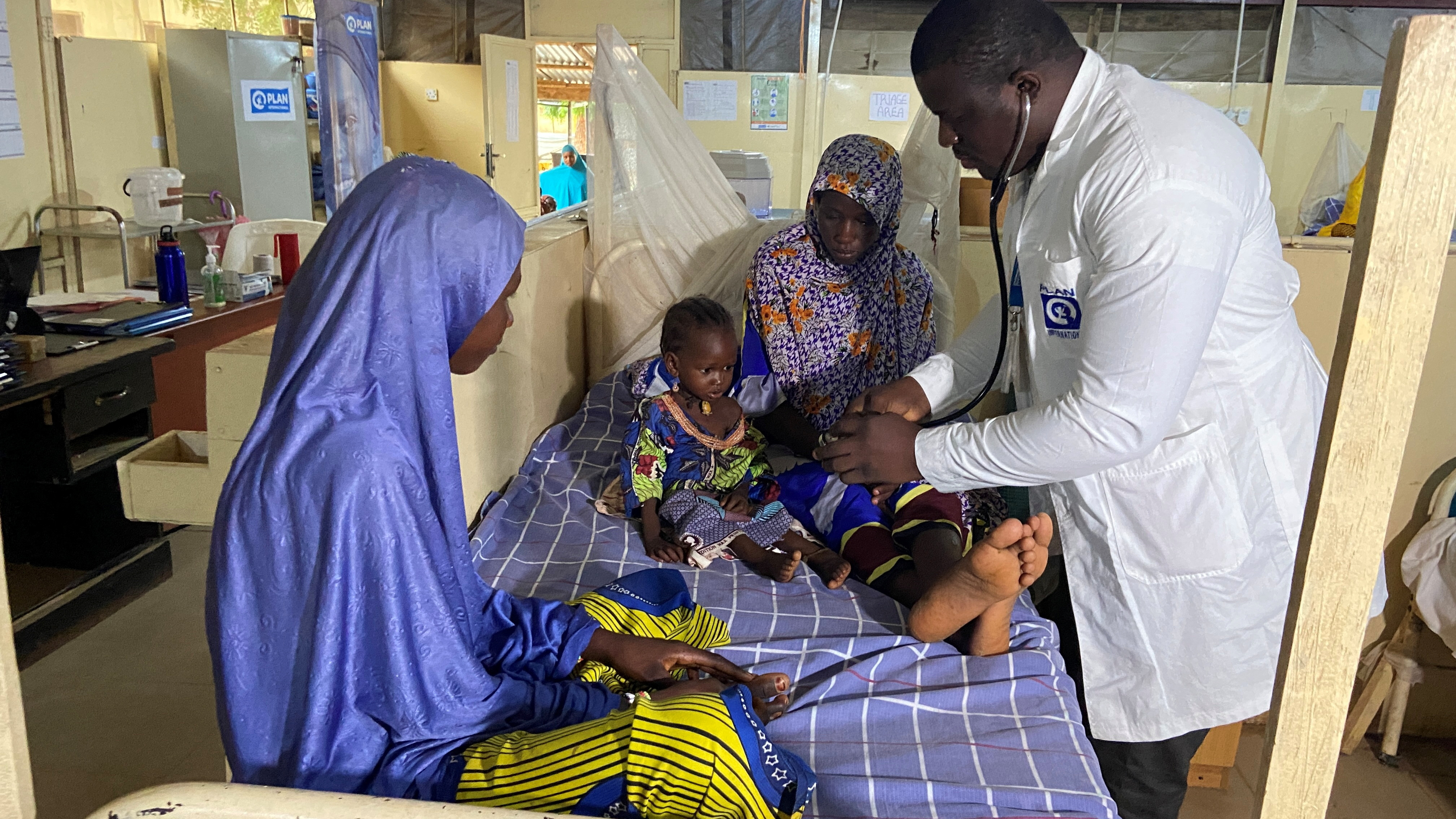 Dr. Japhet Udokwu attends to a child at a treatment center for severely malnourished children in Damaturu