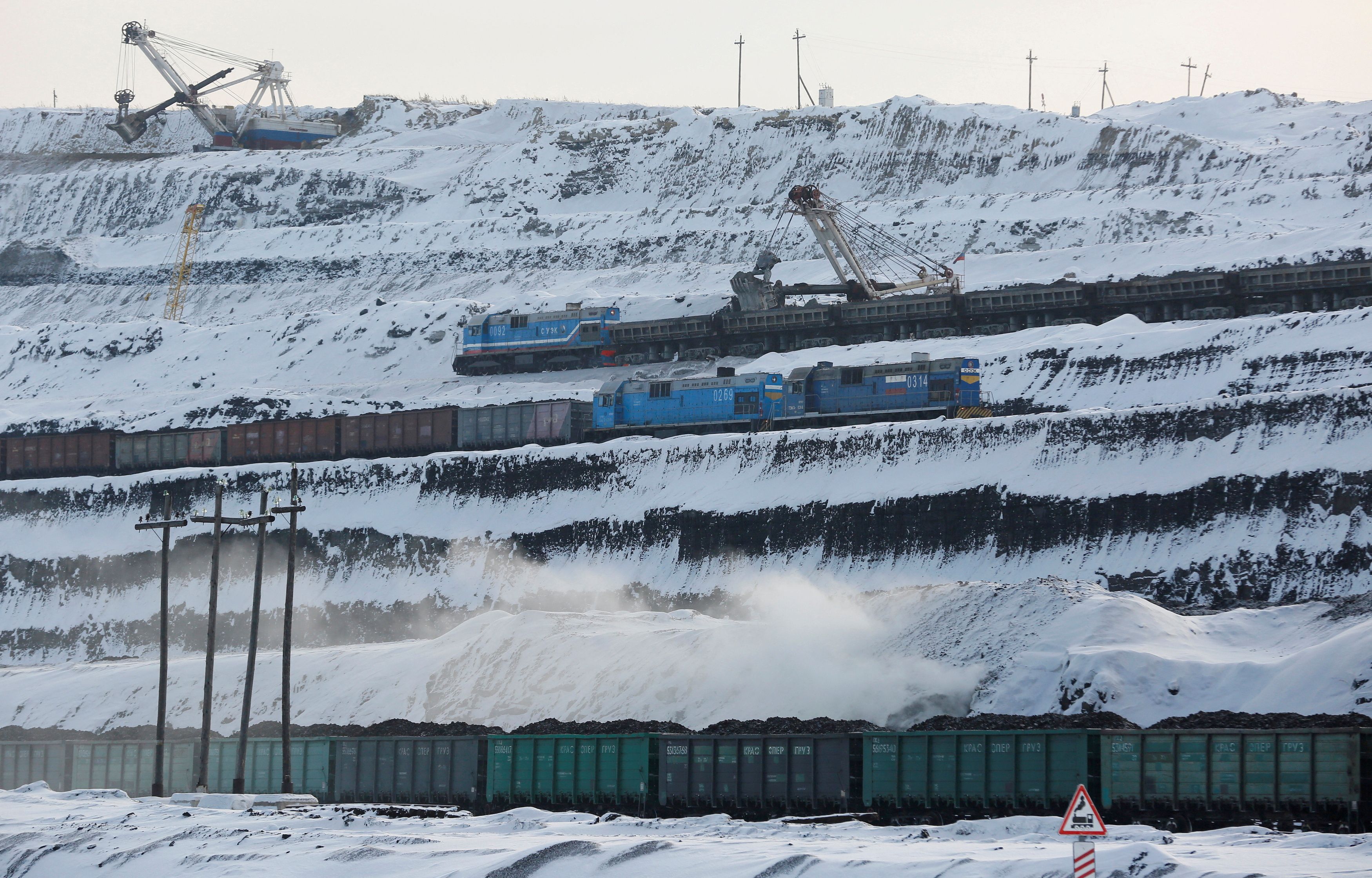 Trains are loaded with coal at Russia's largest Borodinsky opencast colliery, owned by SUEK, near the Siberian town of Borodino