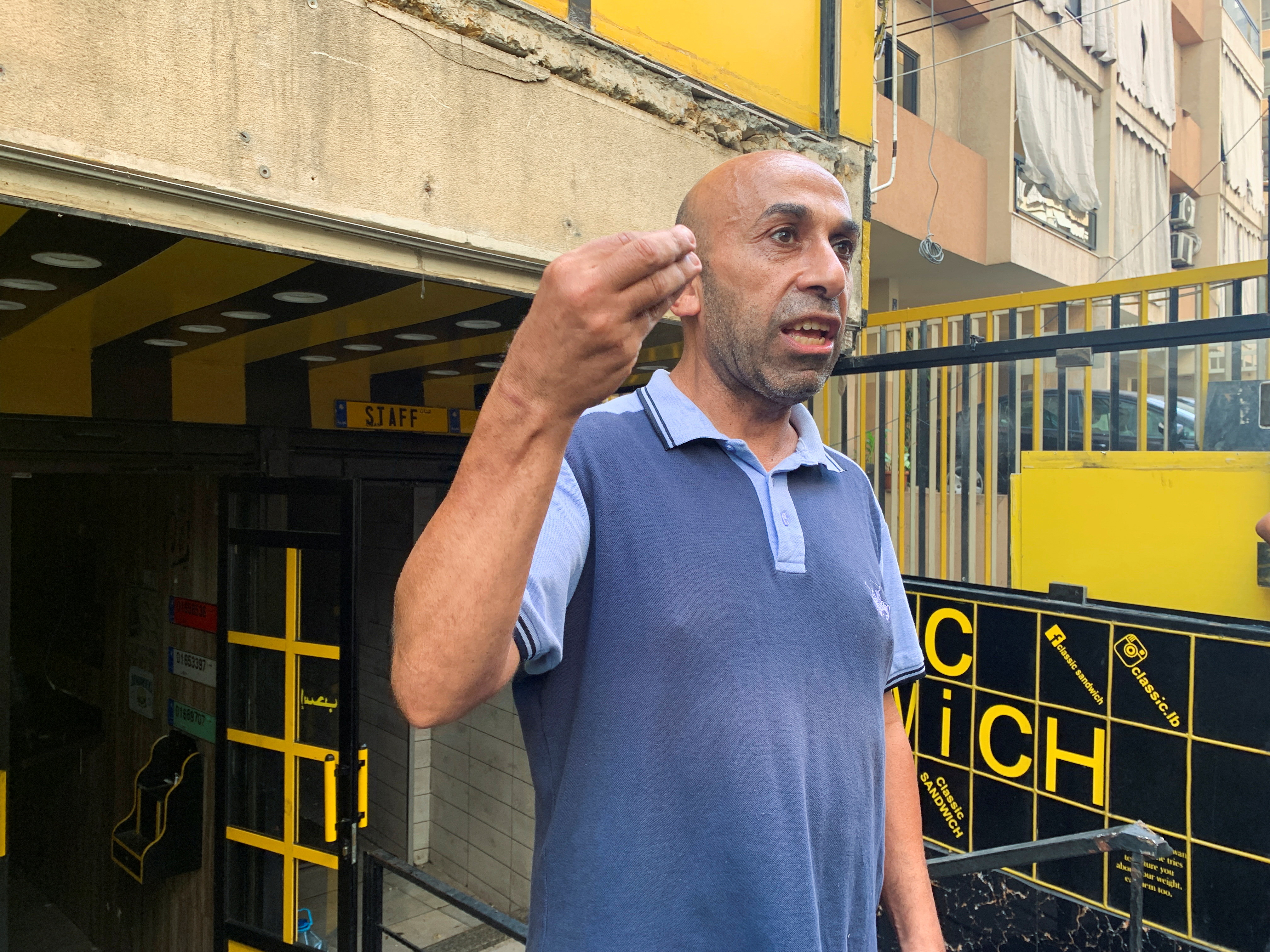 Ibrahim Jaber, a chef who used to work at Classic Sandwich restaurant, gestures during an interview with Reuters, in Beirut