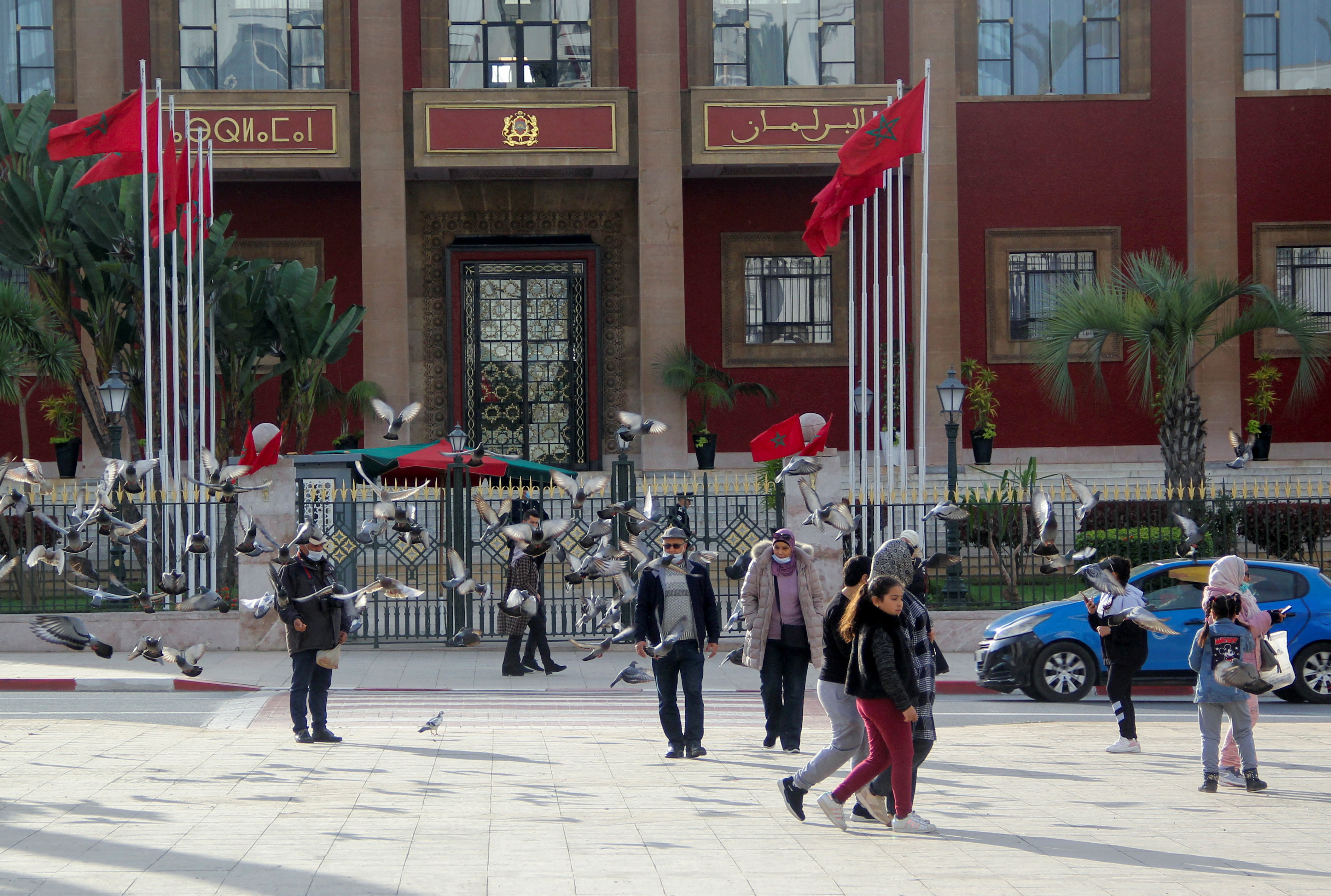 People walk near the parliament building in Rabat