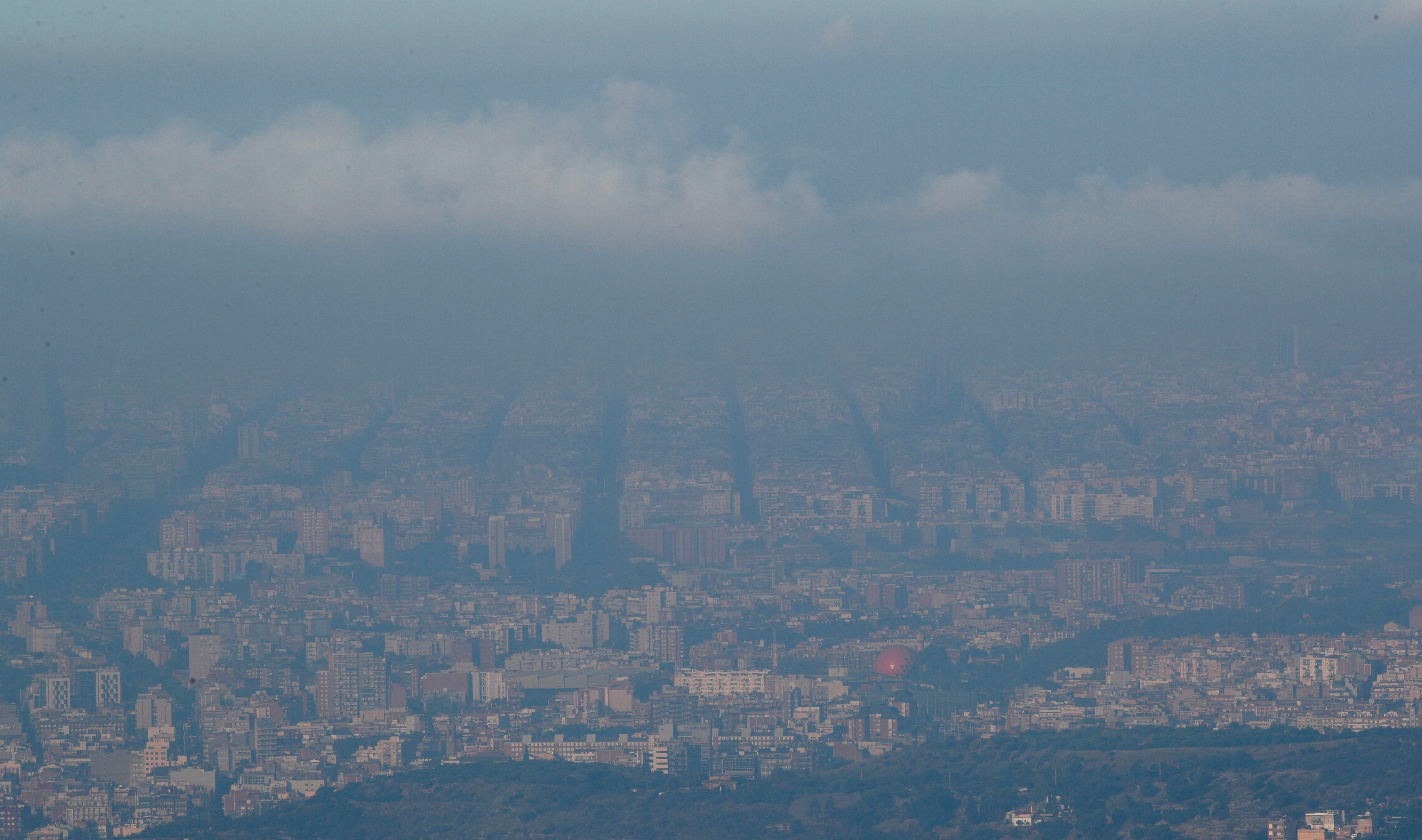 Pollution and clouds are seen over the sky of Barcelona