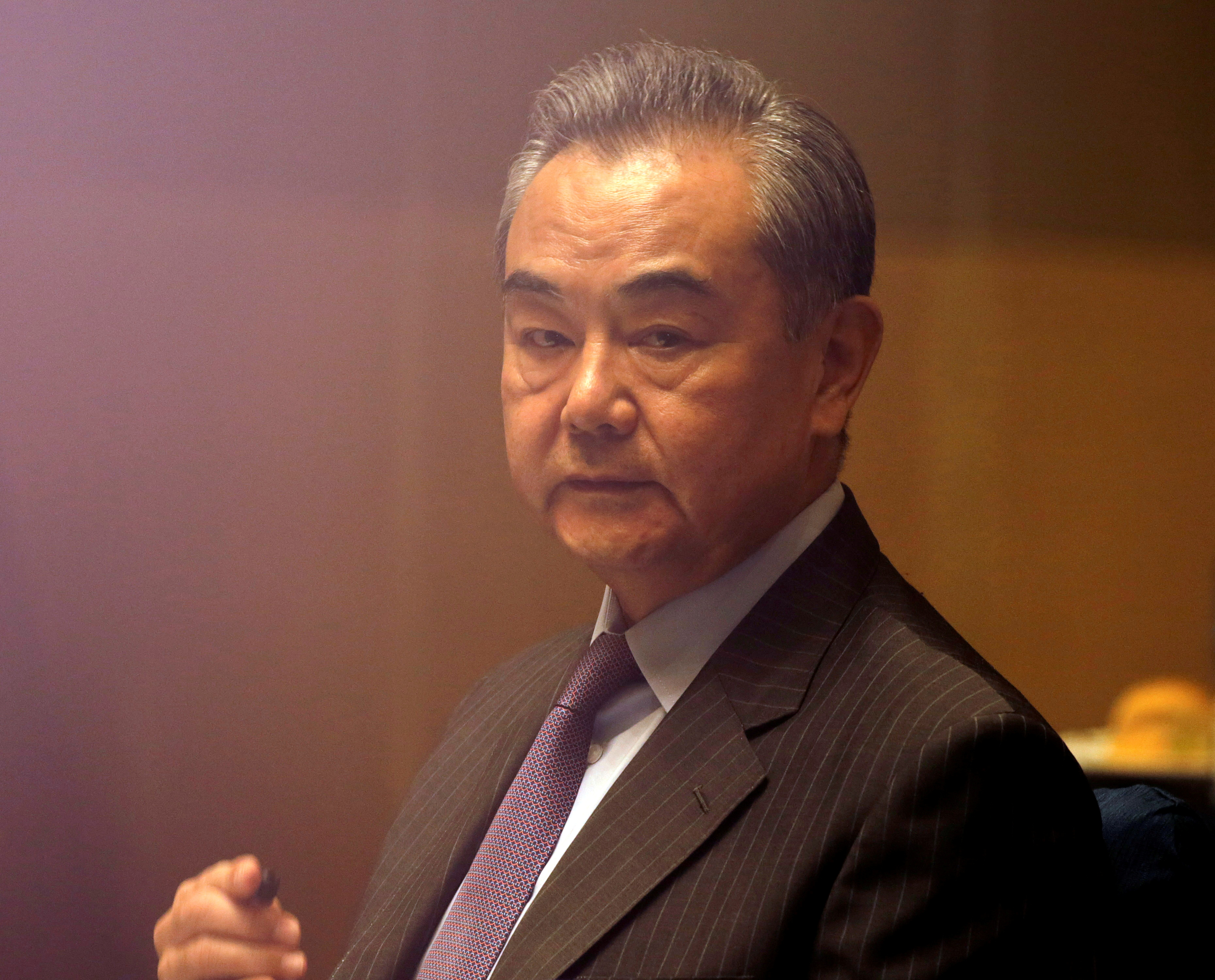 China's Foreign Minister Wang Yi listens during a meeting in Manila, Philippines January 16, 2021. Francis Malasig/Pool via REUTERS
