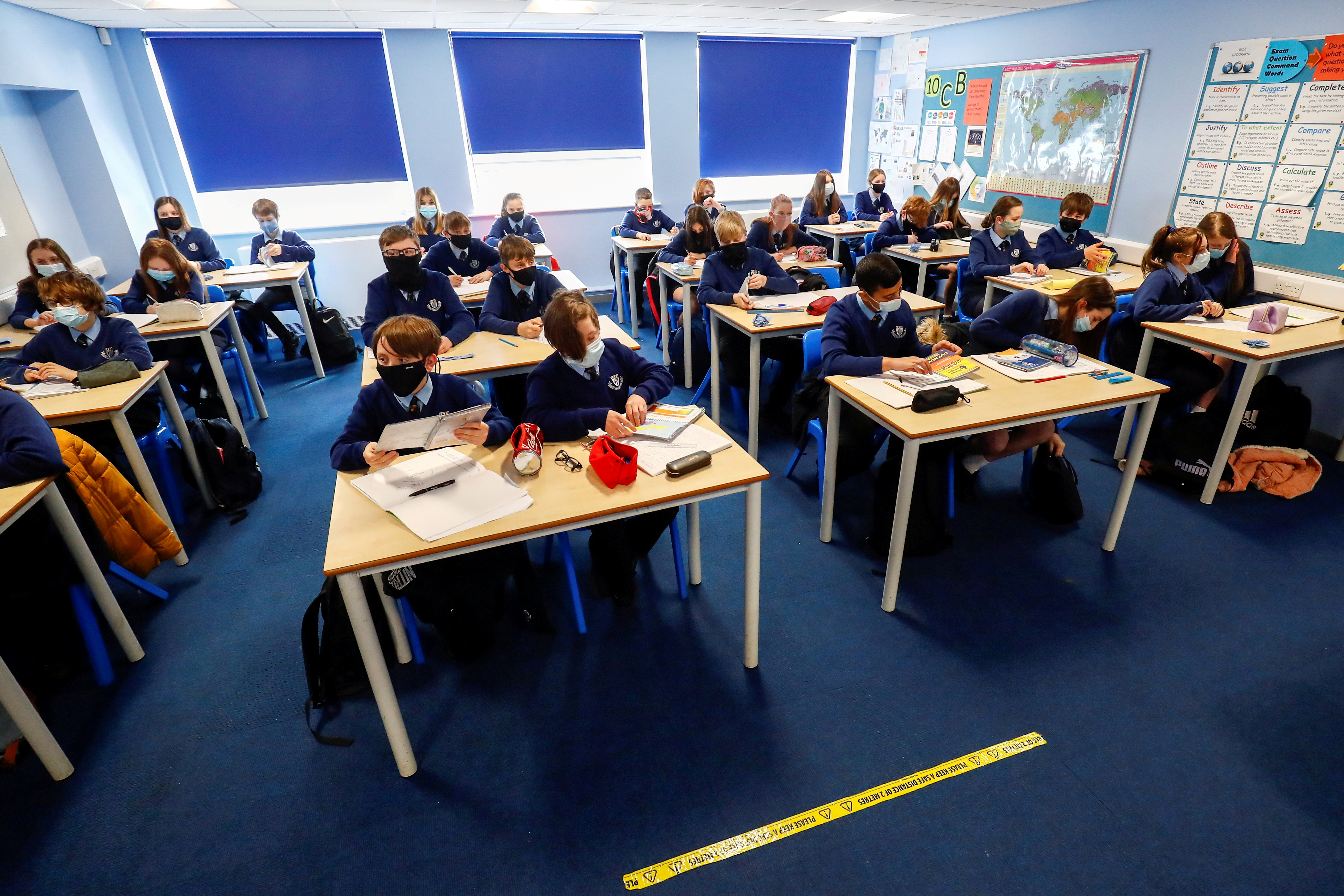 Students attend a lesson at Weaverham High School, as the coronavirus disease (COVID-19) lockdown begins to ease, in Cheshire, Britain, March 9, 2021. REUTERS/Jason Cairnduff