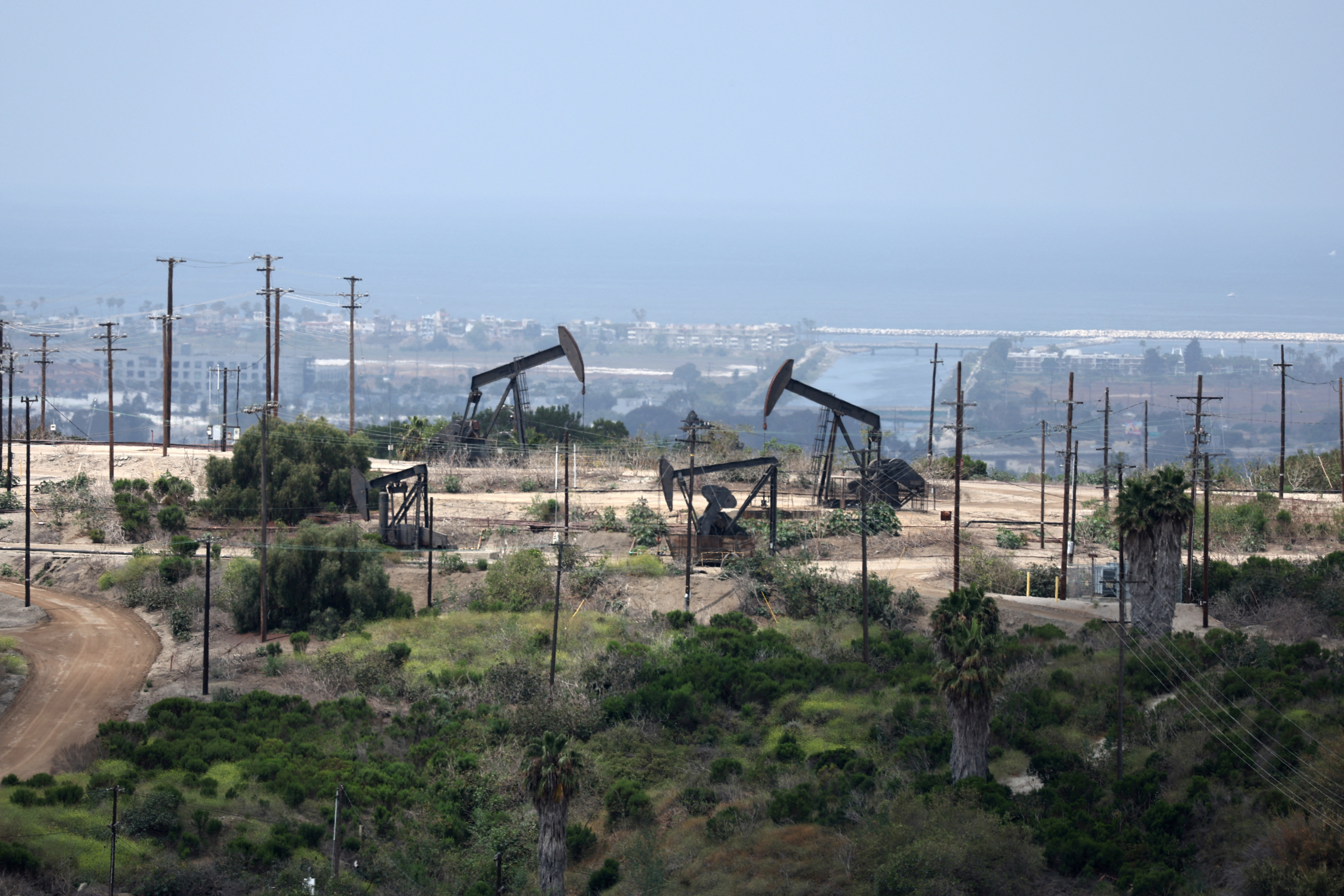 Pump jacks operate in an oil field in Los Angeles
