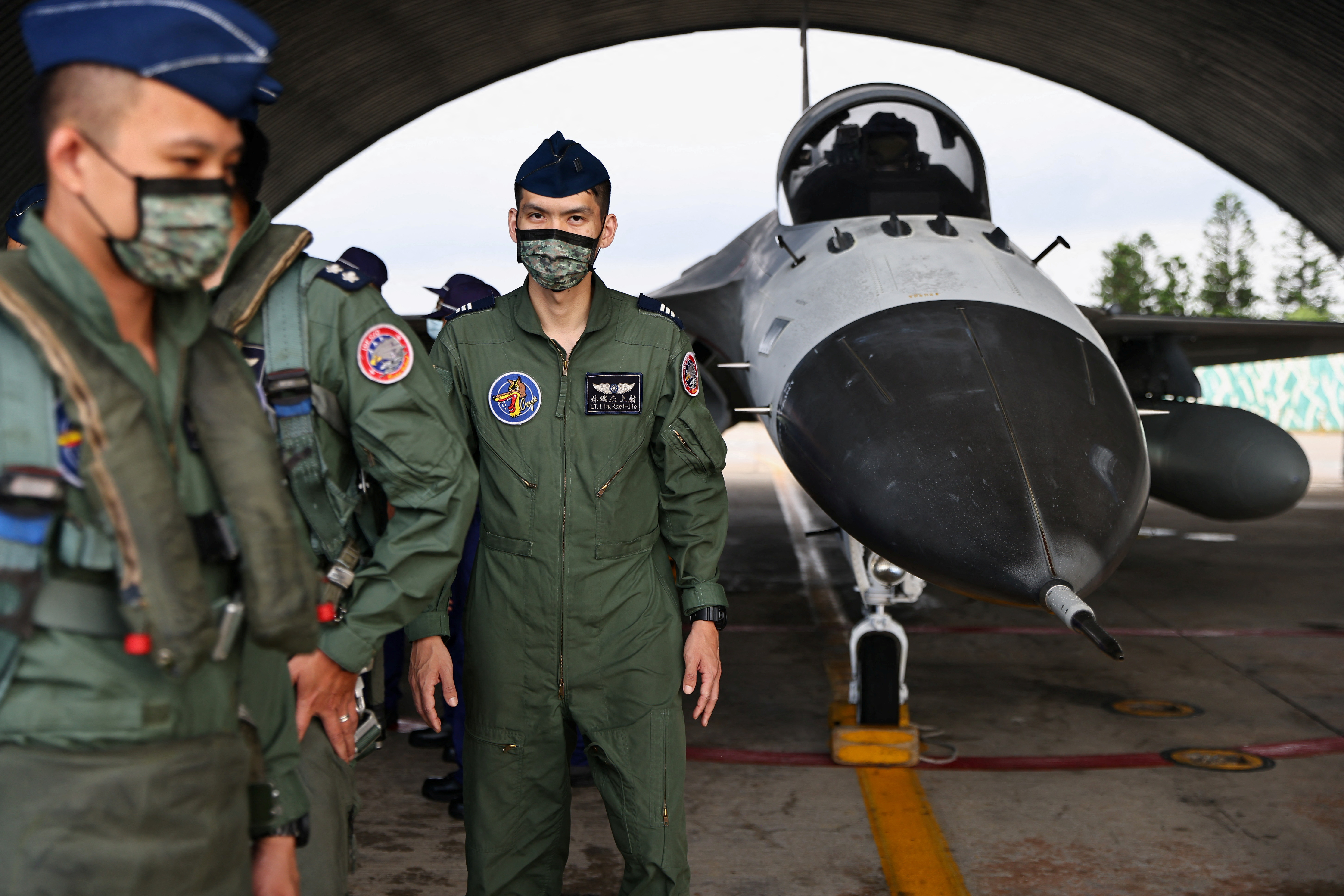 Pilots leave after an event at an Air Force base in Penghu Islands