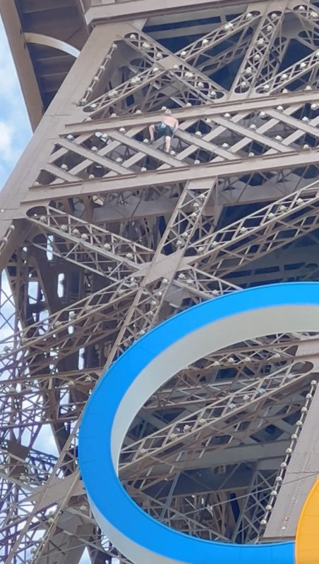 Man climbs Eiffel Tower on Olympics' last day