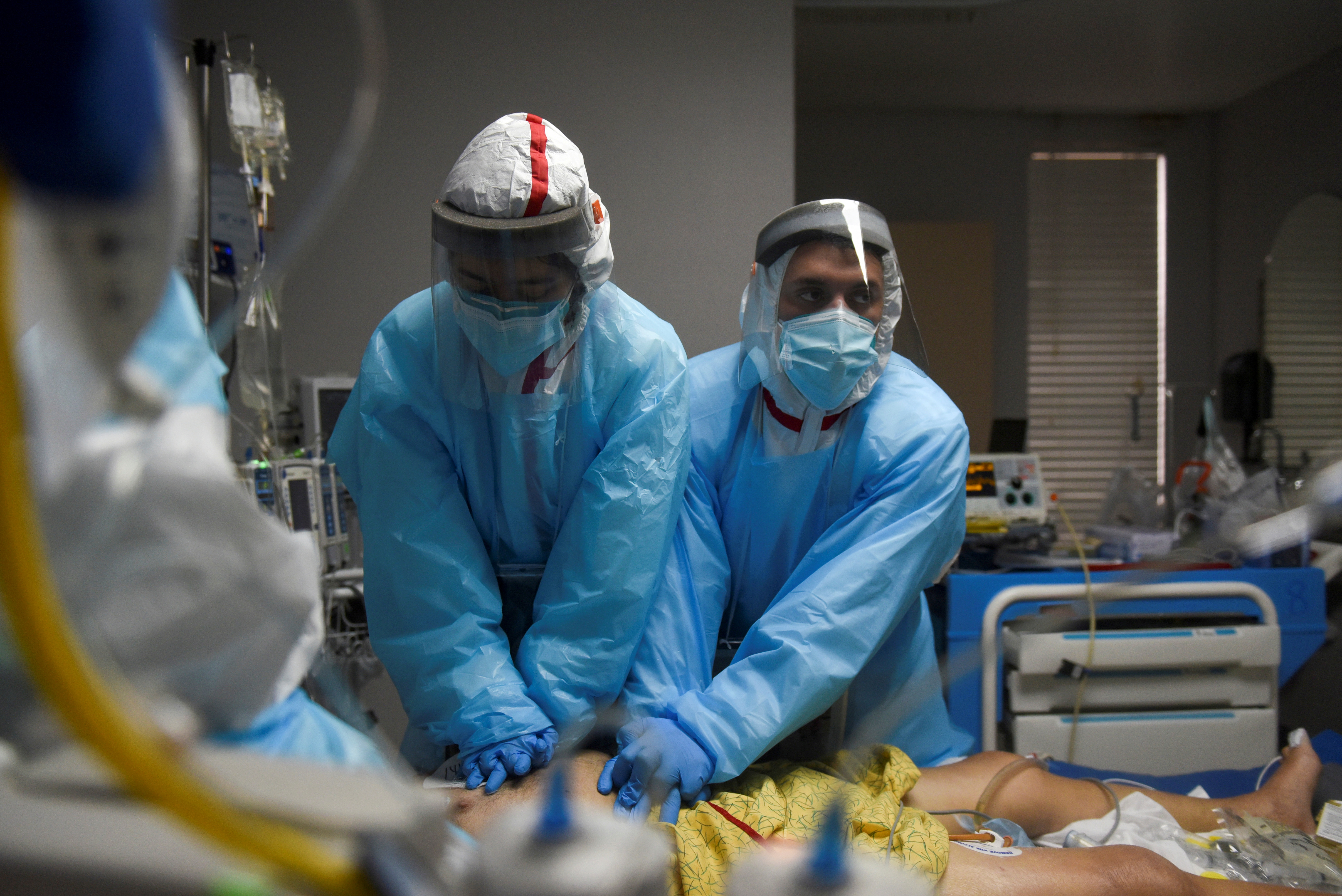 Healthcare personnel work inside a COVID-19 unit in Houston