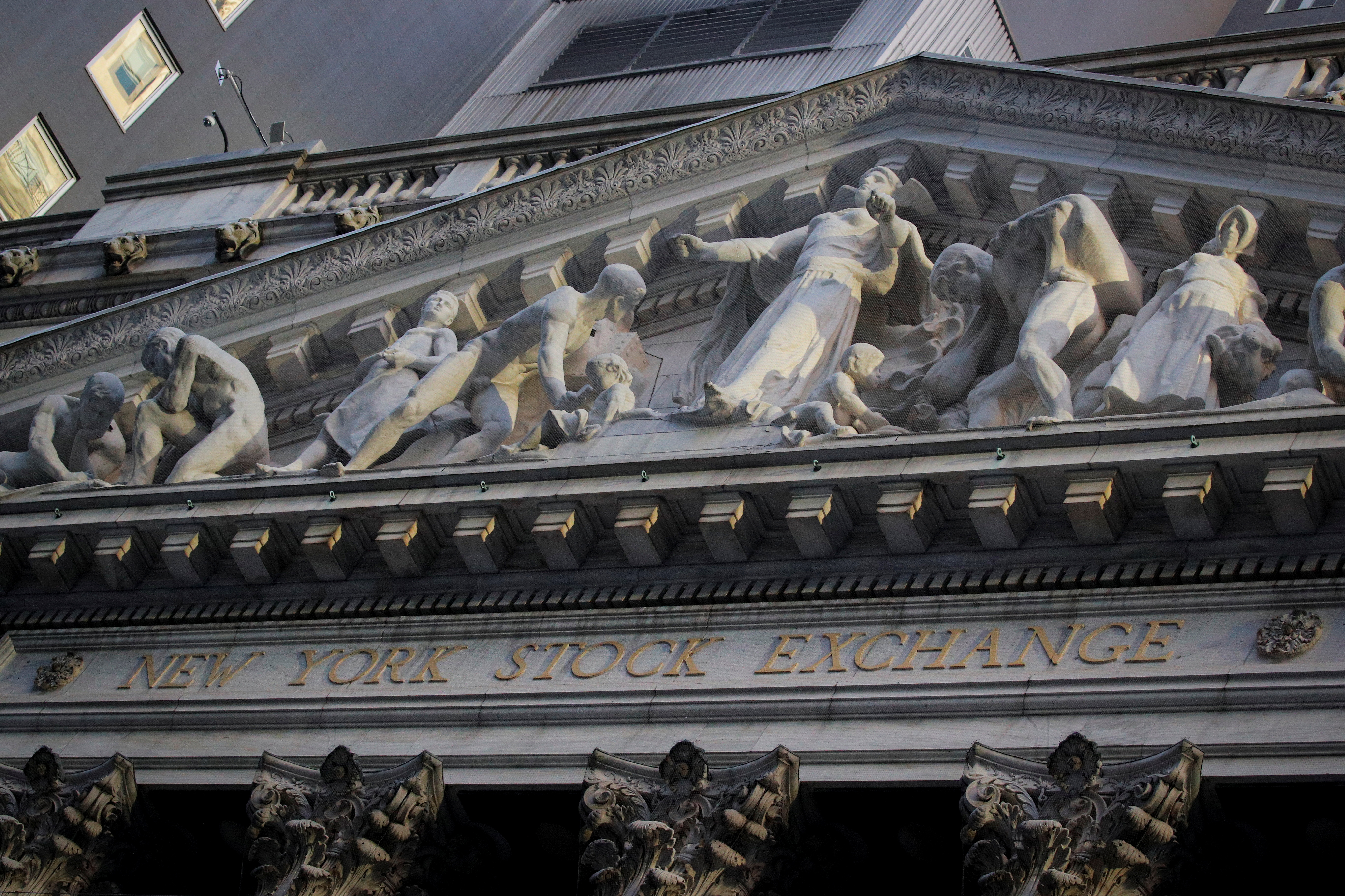 The front facade of the NYSE is ssen in New York