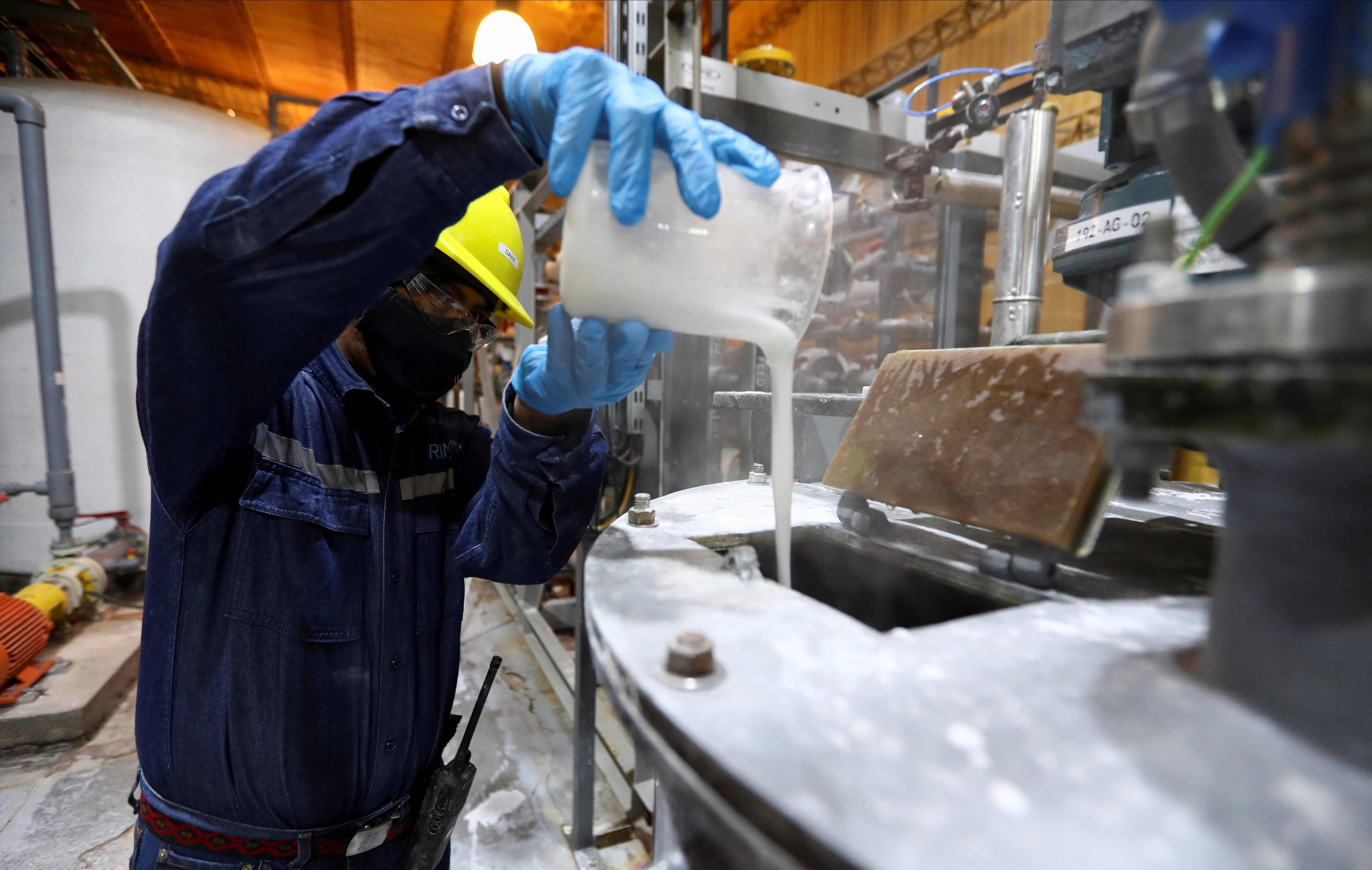 An employee works at the Rincon Mining lithium pilot plant, at the Salar del Rincon salt flat, in Salta, Argentina August 12, 2021. REUTERS/Agustin Marcarian