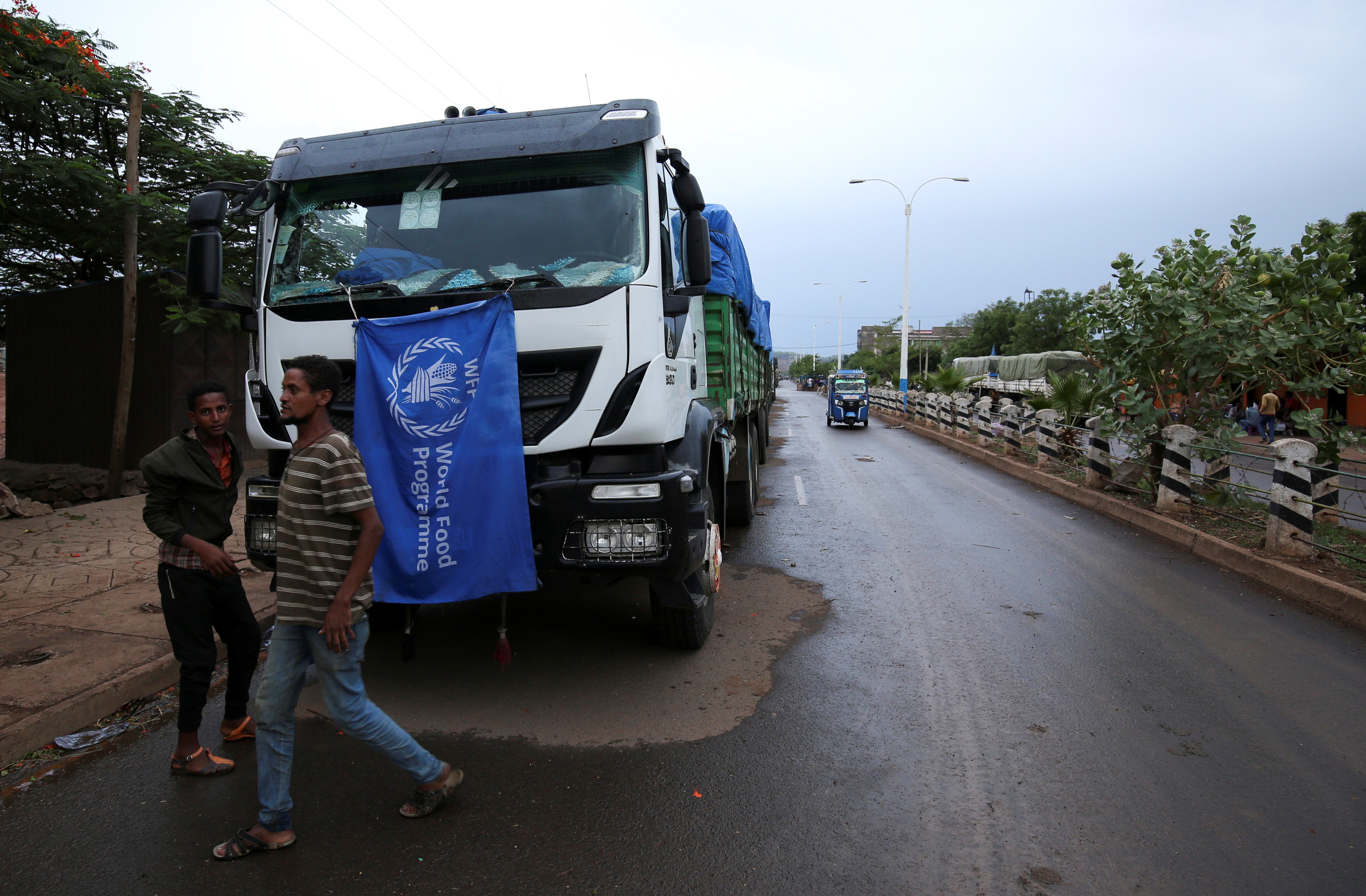 The World Food Program (WFP) convoy trucks carrying food items for the victims of Tigray war are seen parked after the checkpoints leading to Tigray Region were closed, in Mai Tsebri town