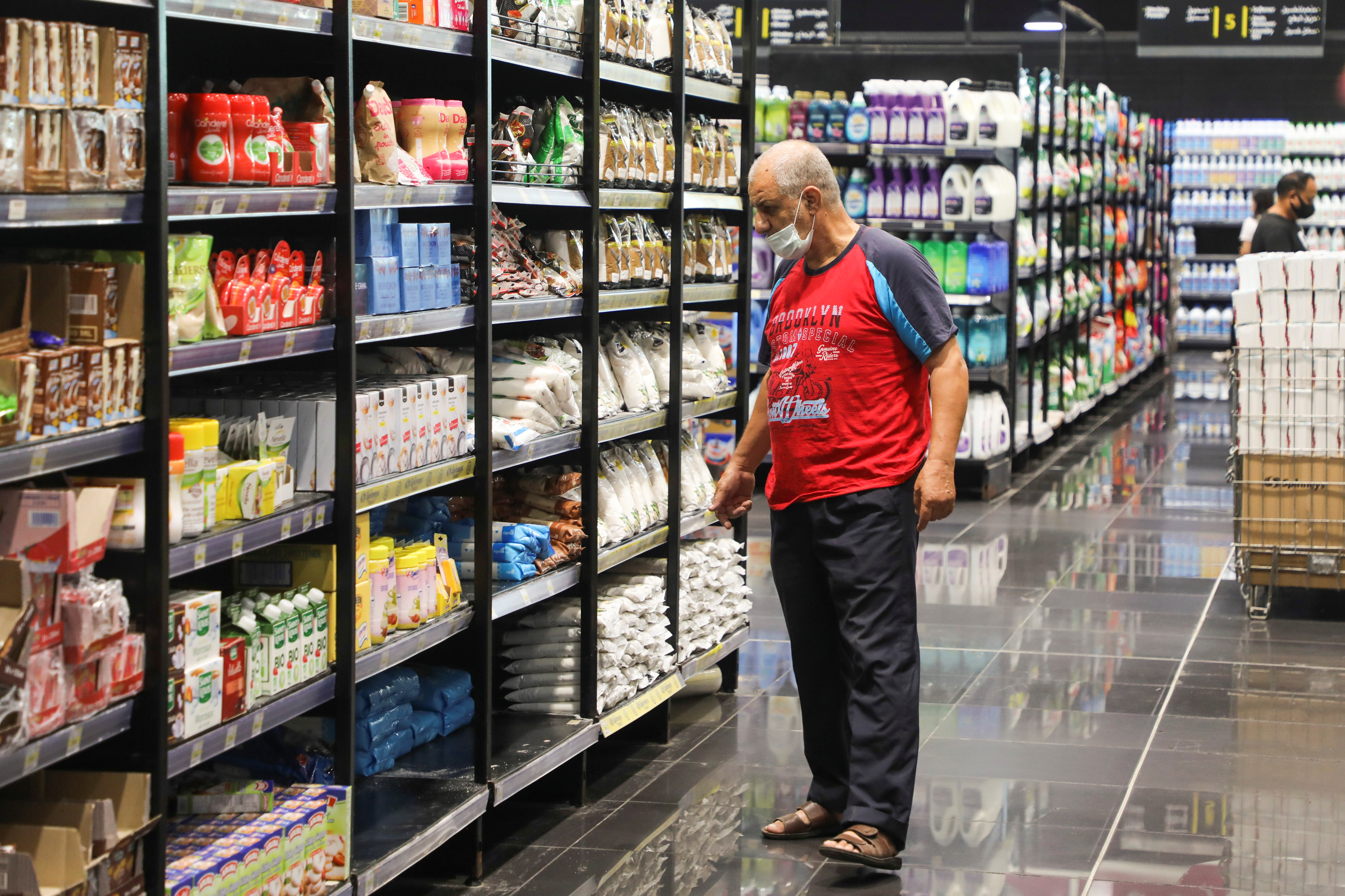 A man checks for prices inside a supermarket in Beirut