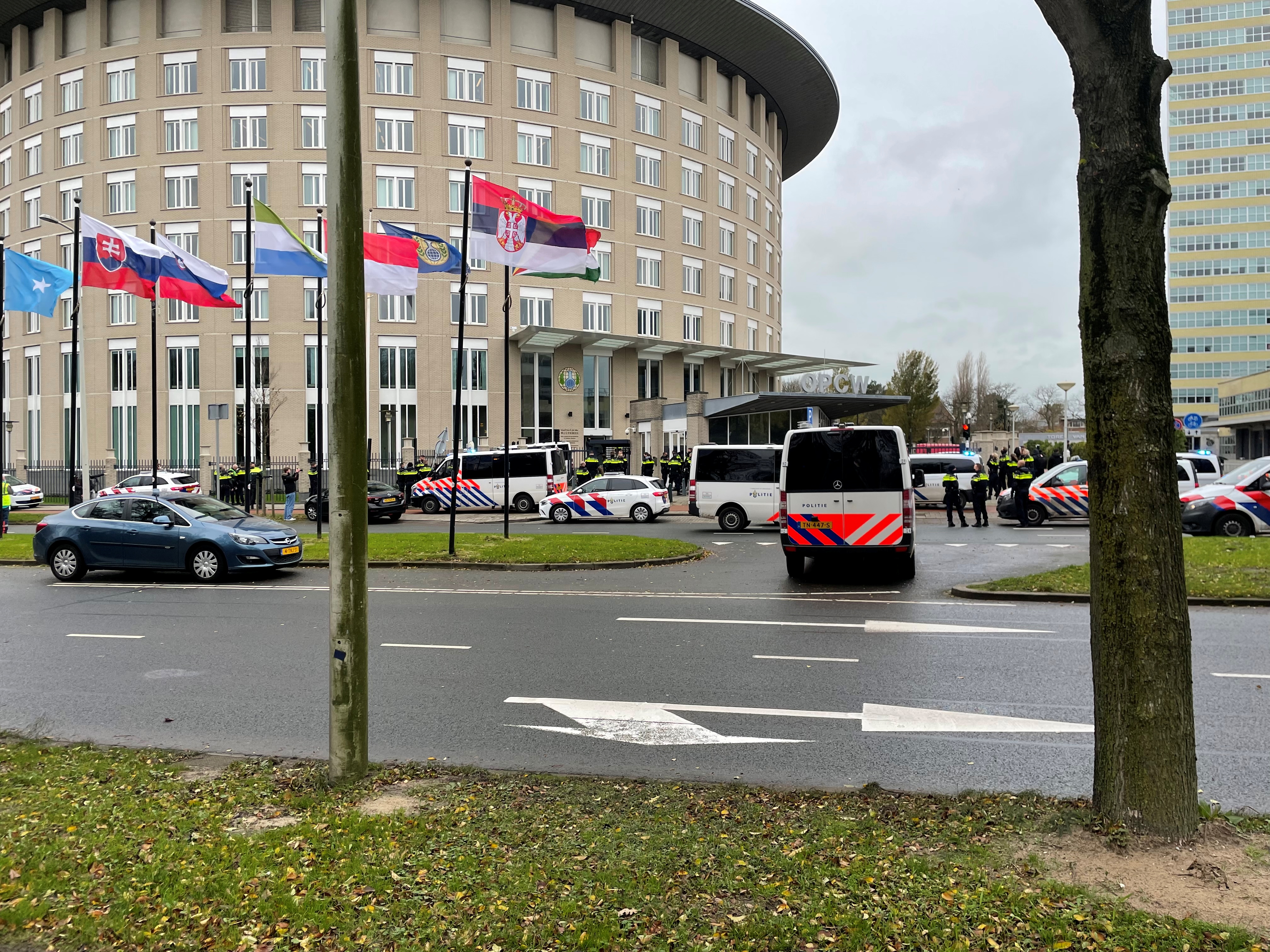 Police officers stand outside the building of the Organisation for the Prohibition of Chemical Weapons (OPCW) in The Hague, Netherlands December 3, 2021 in this image obtained from social media. Courtesy of Twitter/DaveKlain/via REUTERS THIS IMAGE HAS BEEN SUPPLIED BY A THIRD PARTY. MANDATORY CREDIT. NO RESALES. NO ARCHIVES.