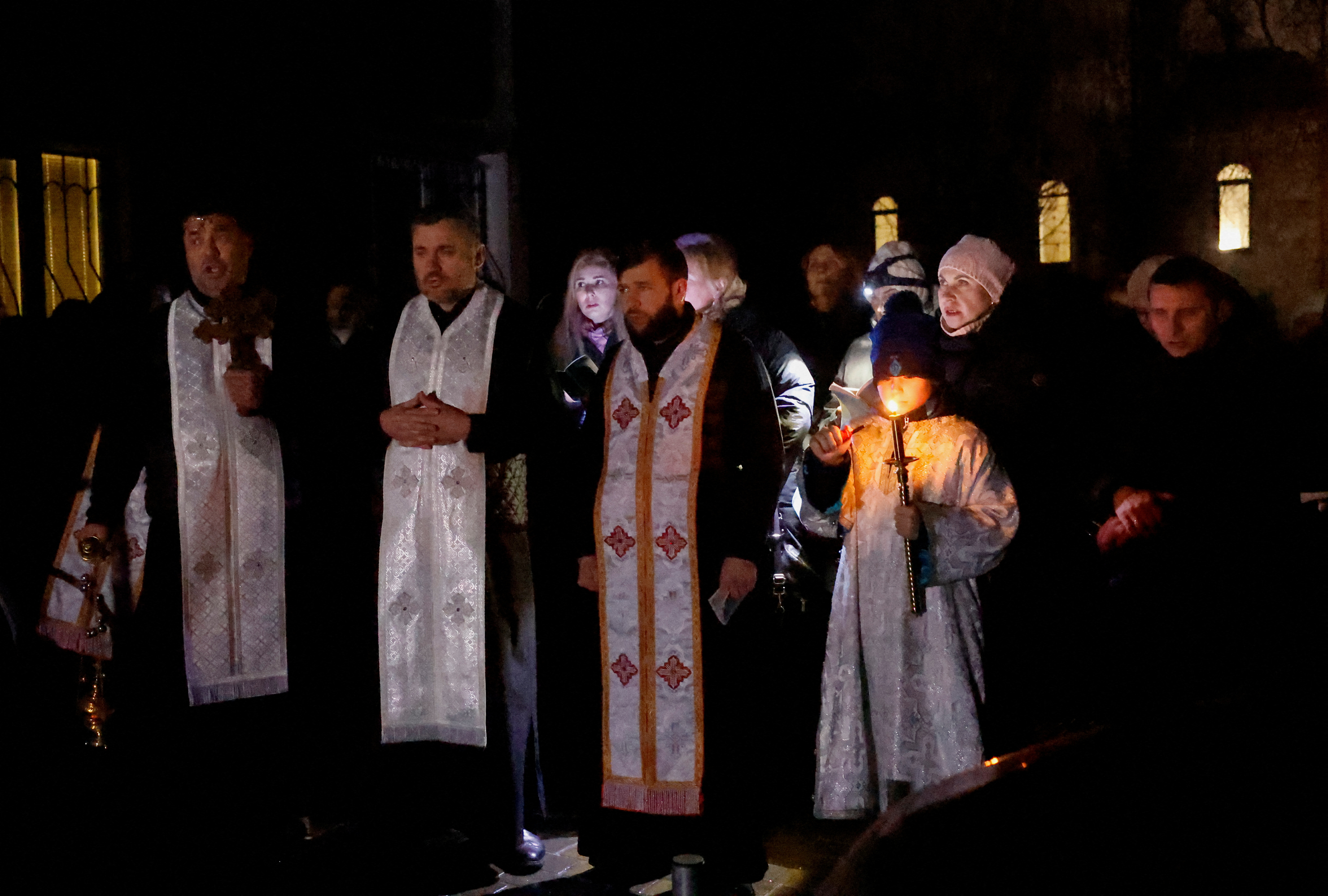 People take part in a Ukrainian orthodox vigil in Brovary