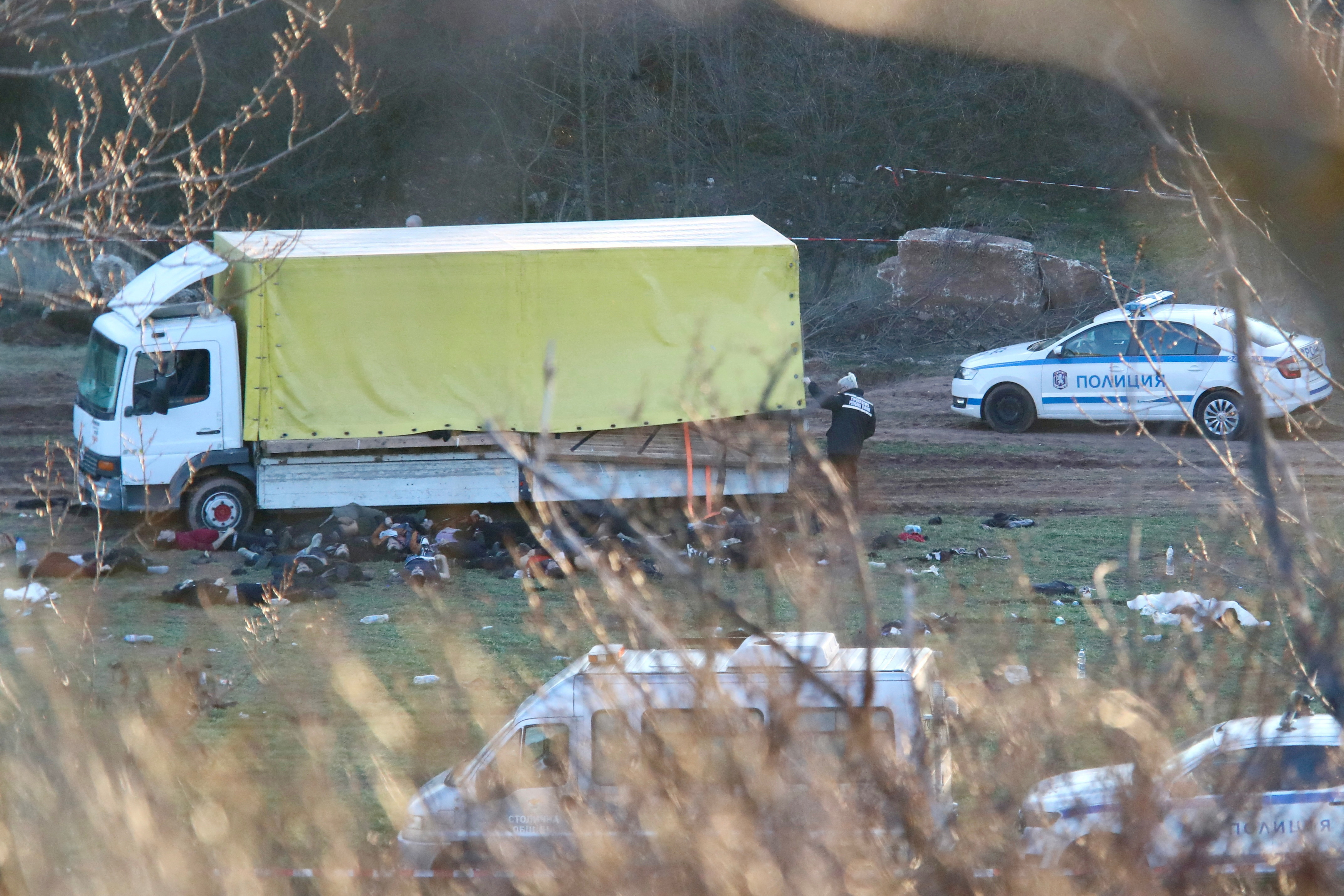 The bodies of migrants are seen next to a truck near Sofia