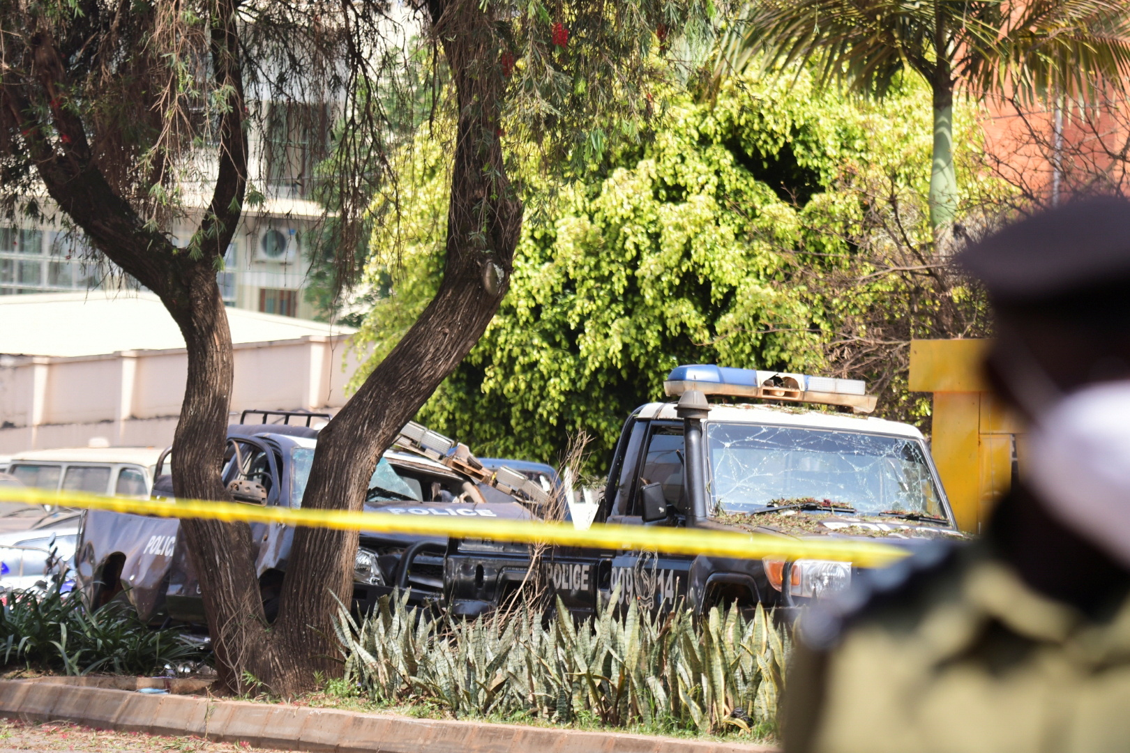 A general view shows wreckages of police vehicles at the scene of a blast in Kampala, Uganda November 16, 2021. REUTERS/Abubaker Lubowa