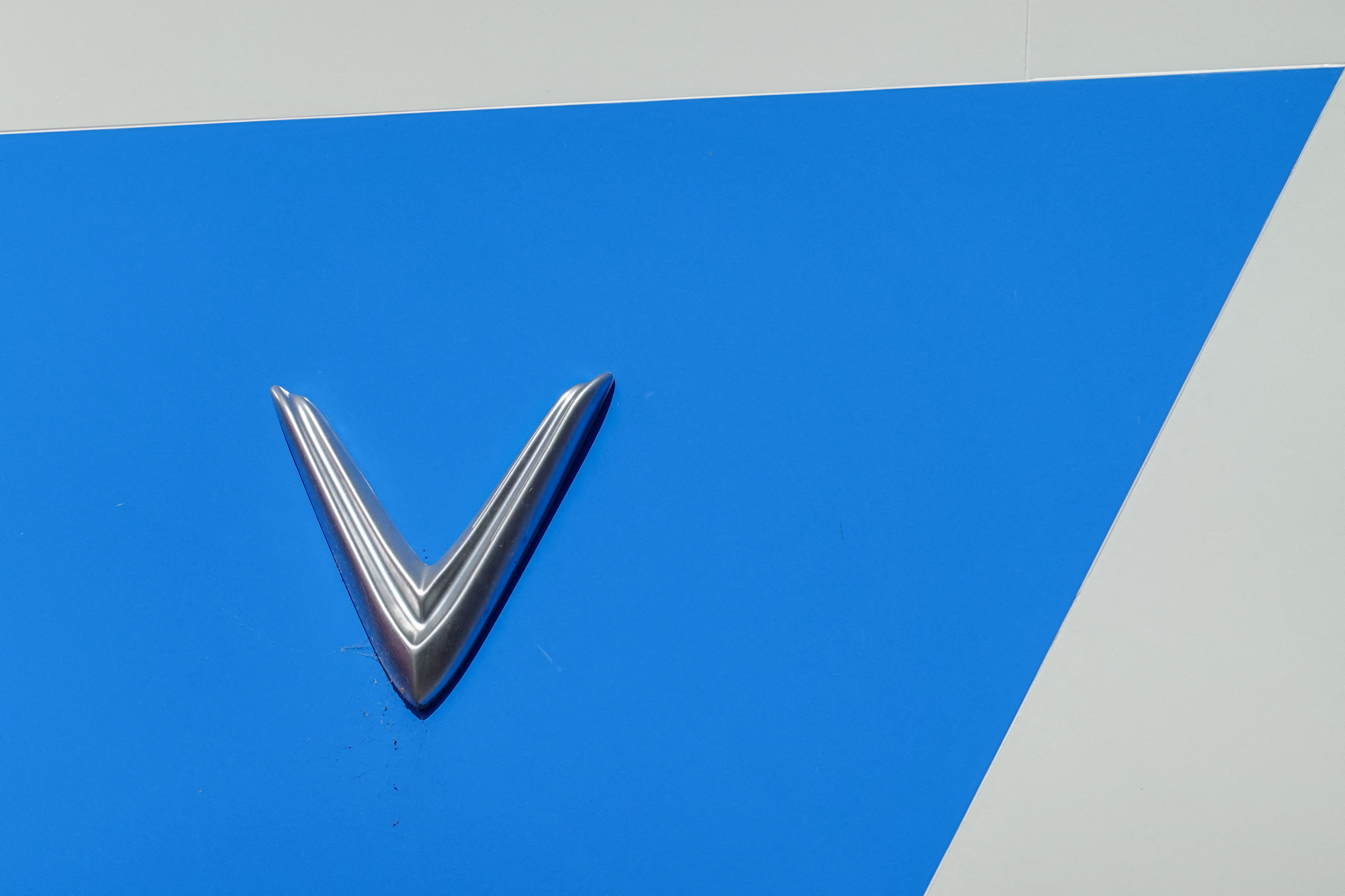 A Vinfast electric vehicle logo on a company store in California