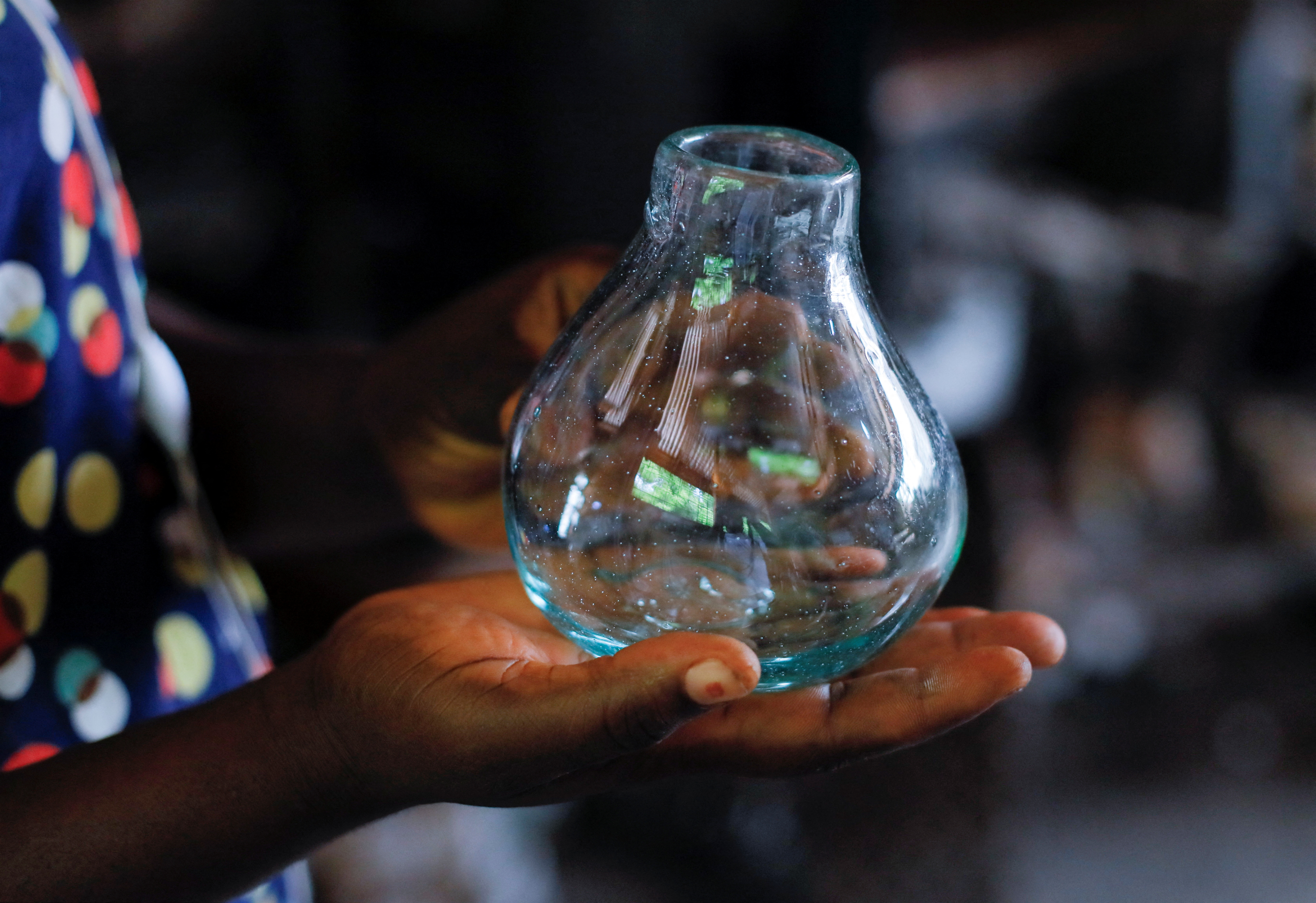 Ghana's only glassblower Michael Tetteh produces glassware at his glassware manufacturing workshop in Krobo Odumase