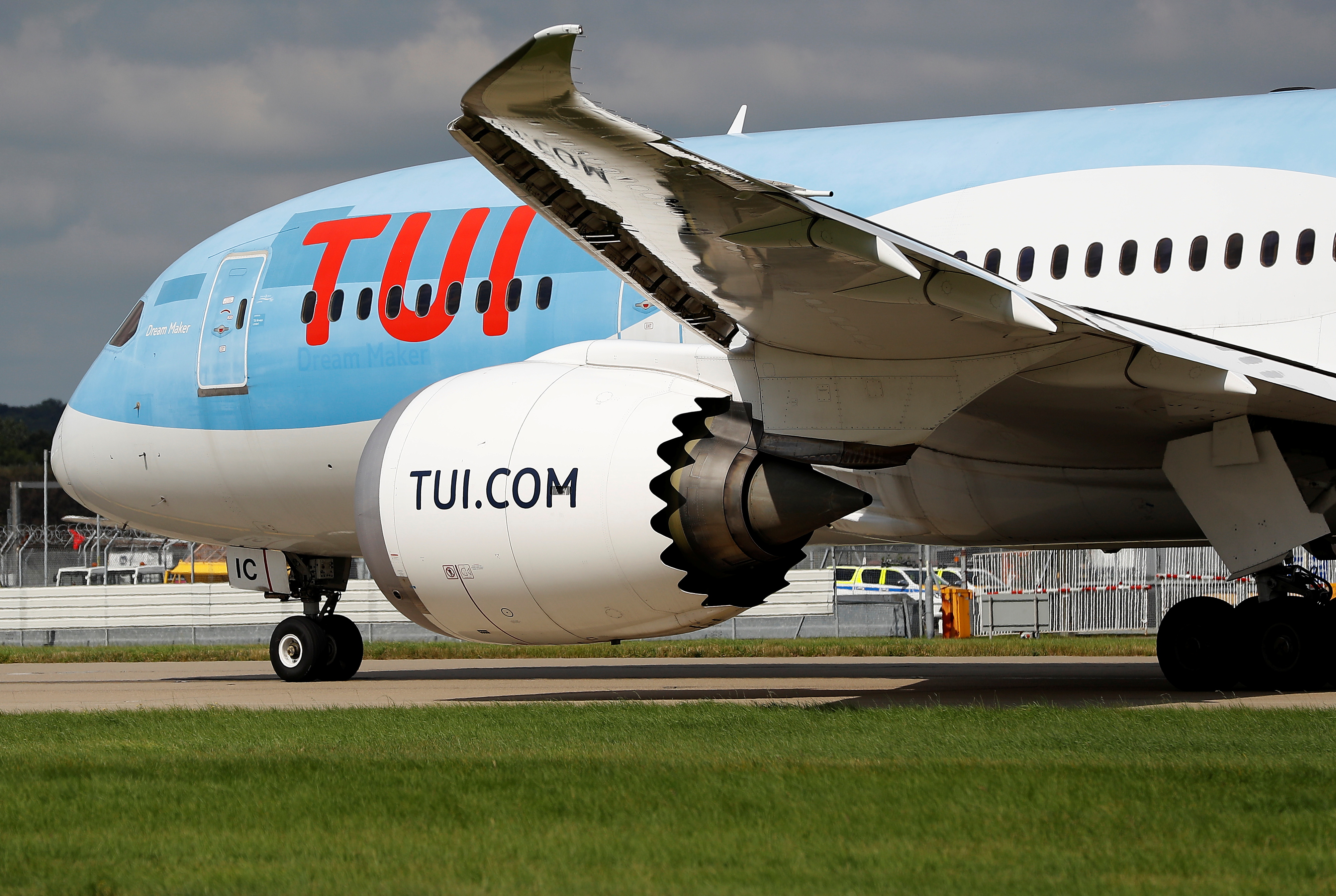 A Boeing 787 of the travel company TUI taxis close to the northern runway at Gatwick Airport in Crawley