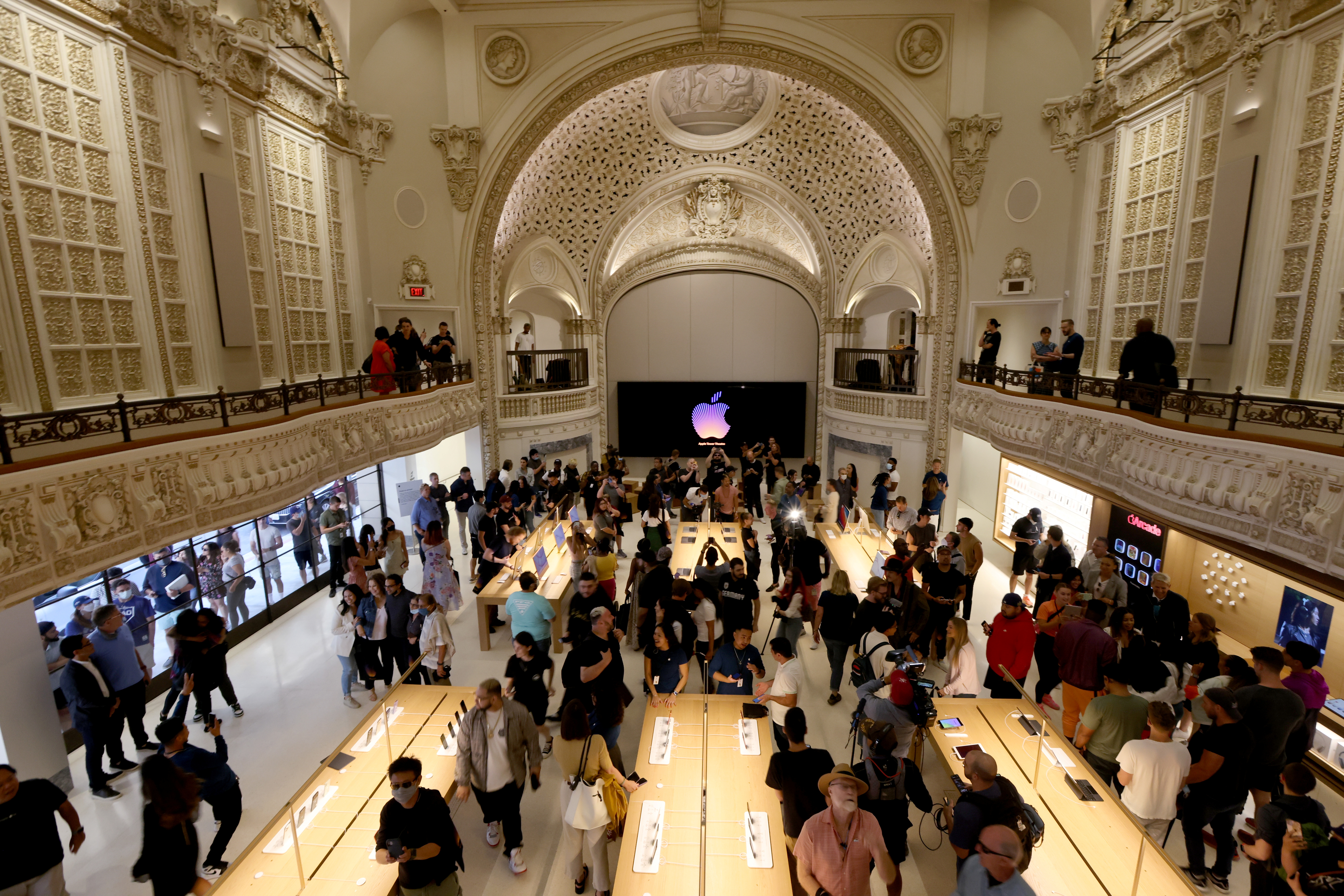 Customers browse products at the new Apple Store on Broadway in downtown Los Angeles, California, U.S., June 24, 2021. REUTERS/Lucy Nicholson