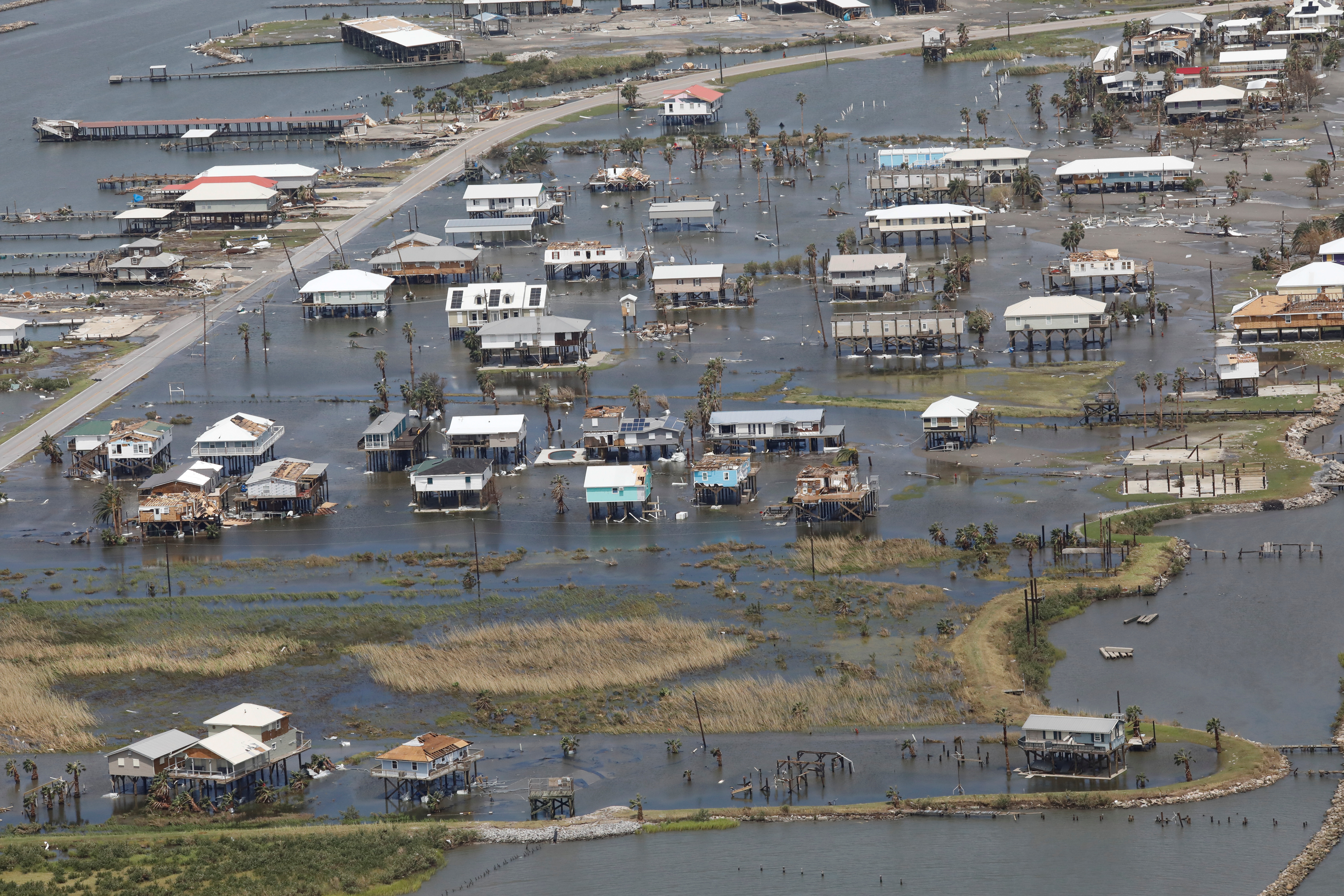 An aerial view shows destroyed houses in a flooded area after Hurricane Ida made landfall in Louisiana, in Grand Isle, Louisiana, U.S. August 31, 2021. REUTERS/Marco Bello