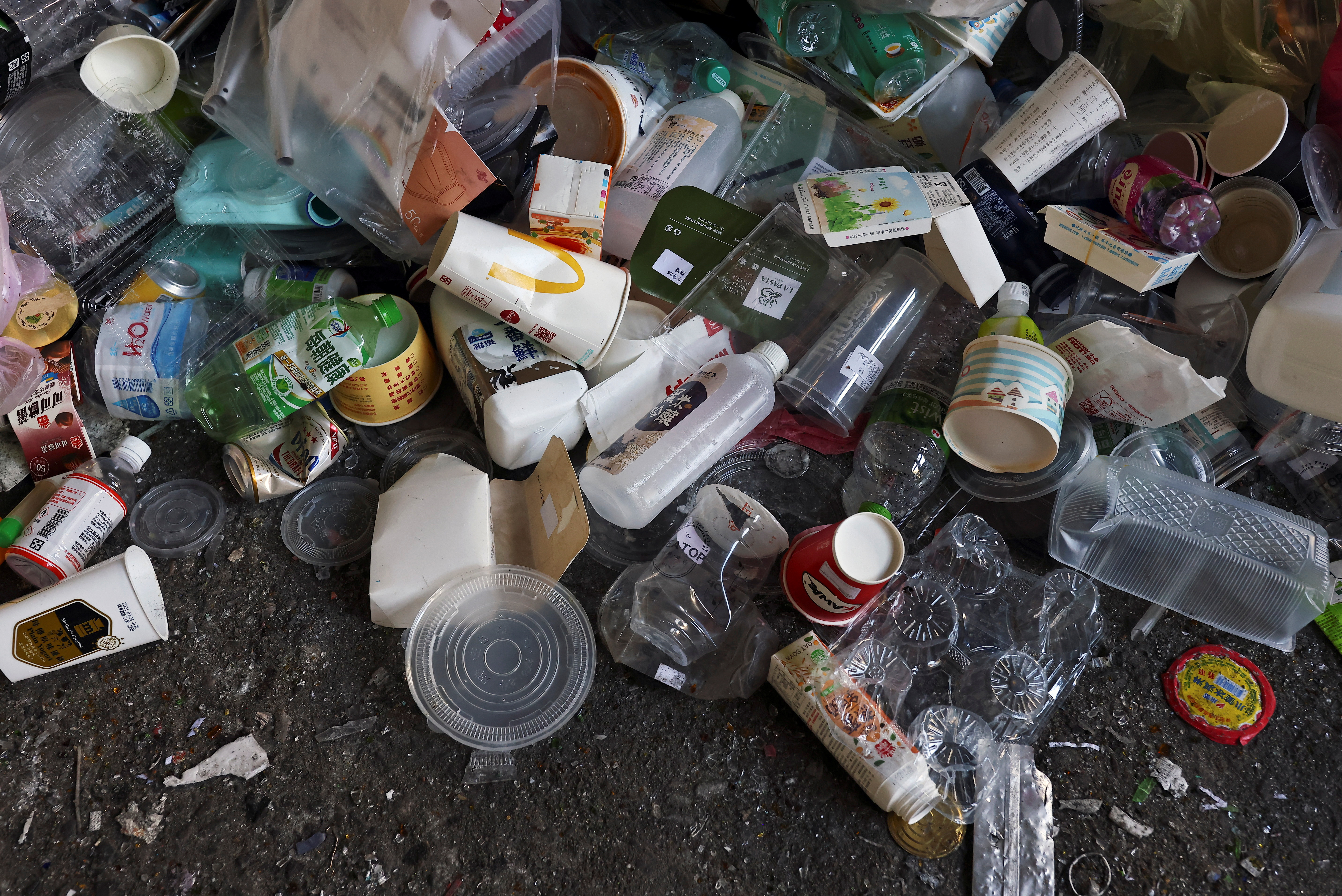 Take-out containers are seen amid other trash at a waste collection plant in Taipei