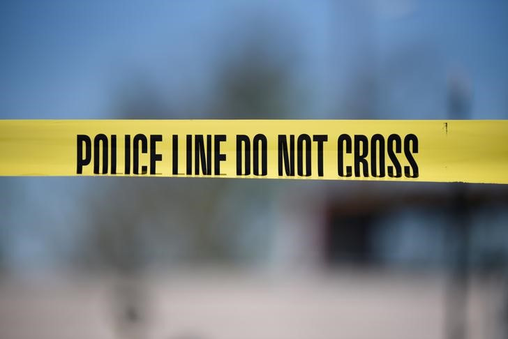 Crime scene tape blocks off an area designated for the media at the scene of a blast at a FedEx facility in Schertz, Texas