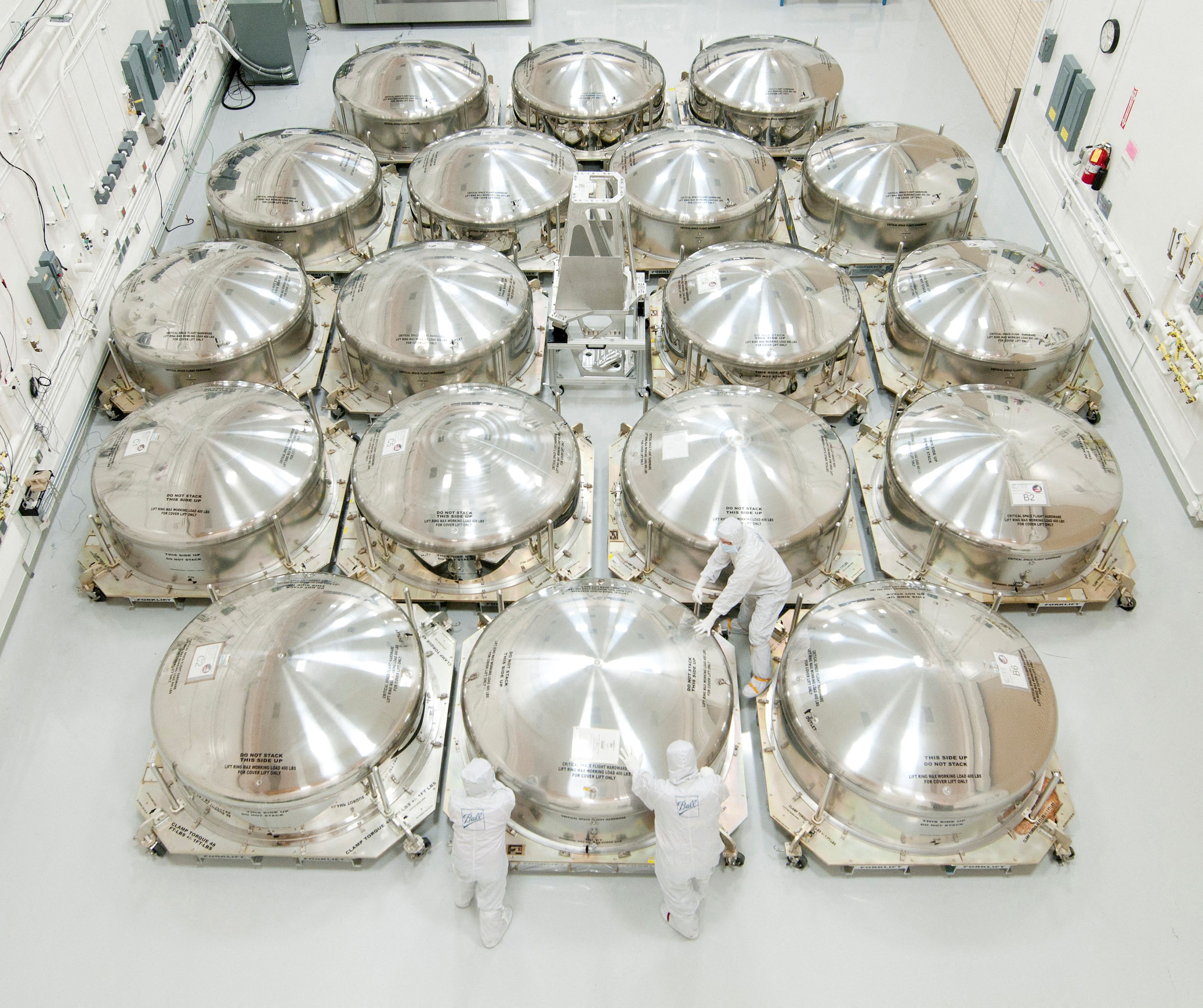Mirror segments for NASA's James Webb Space Telescope are packed in special shipping canisters in Boulder