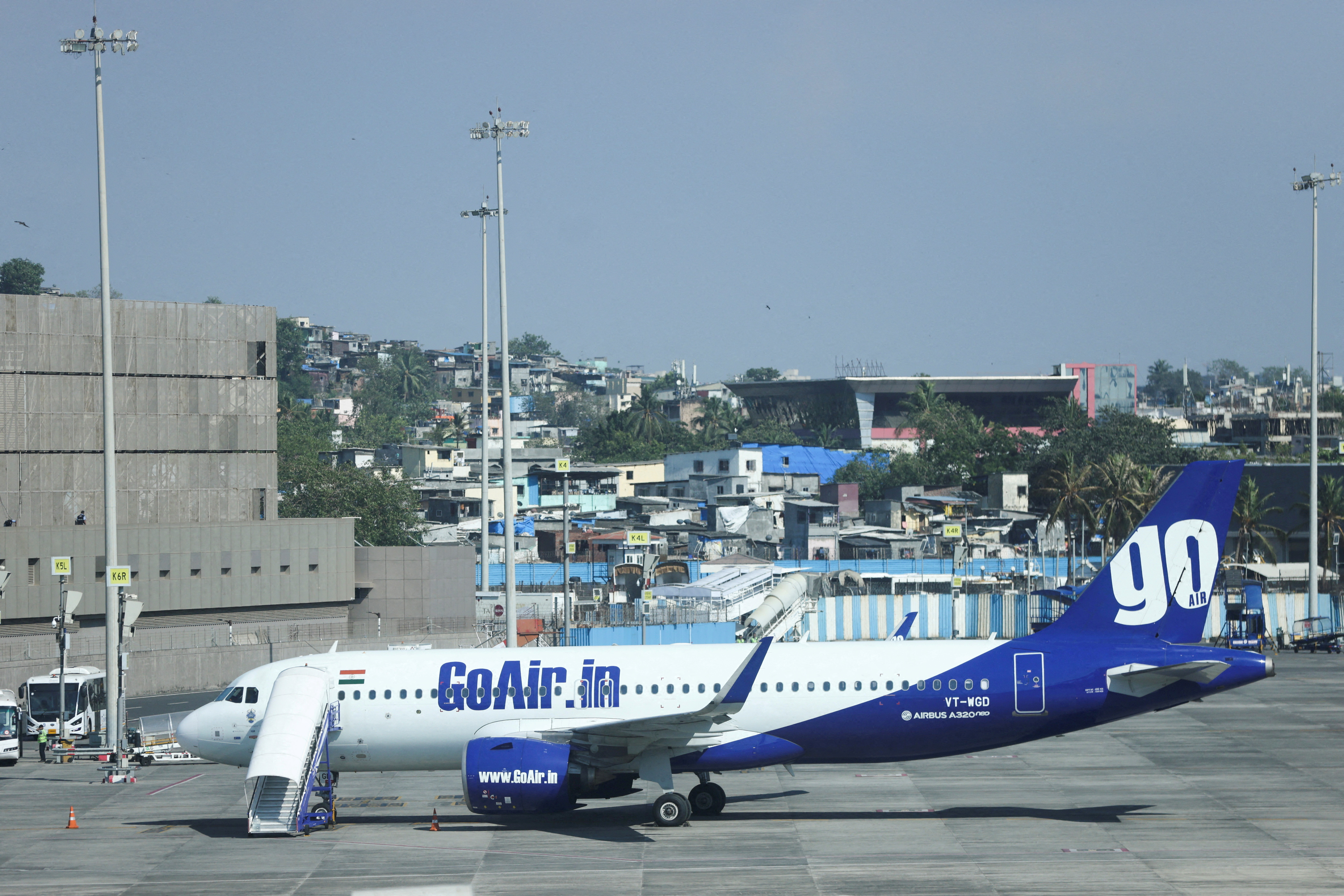 A Go First airline, formerly known as GoAir, passenger aircraft is parked at the Chhatrapati Shivaji International Airport in Mumbai,