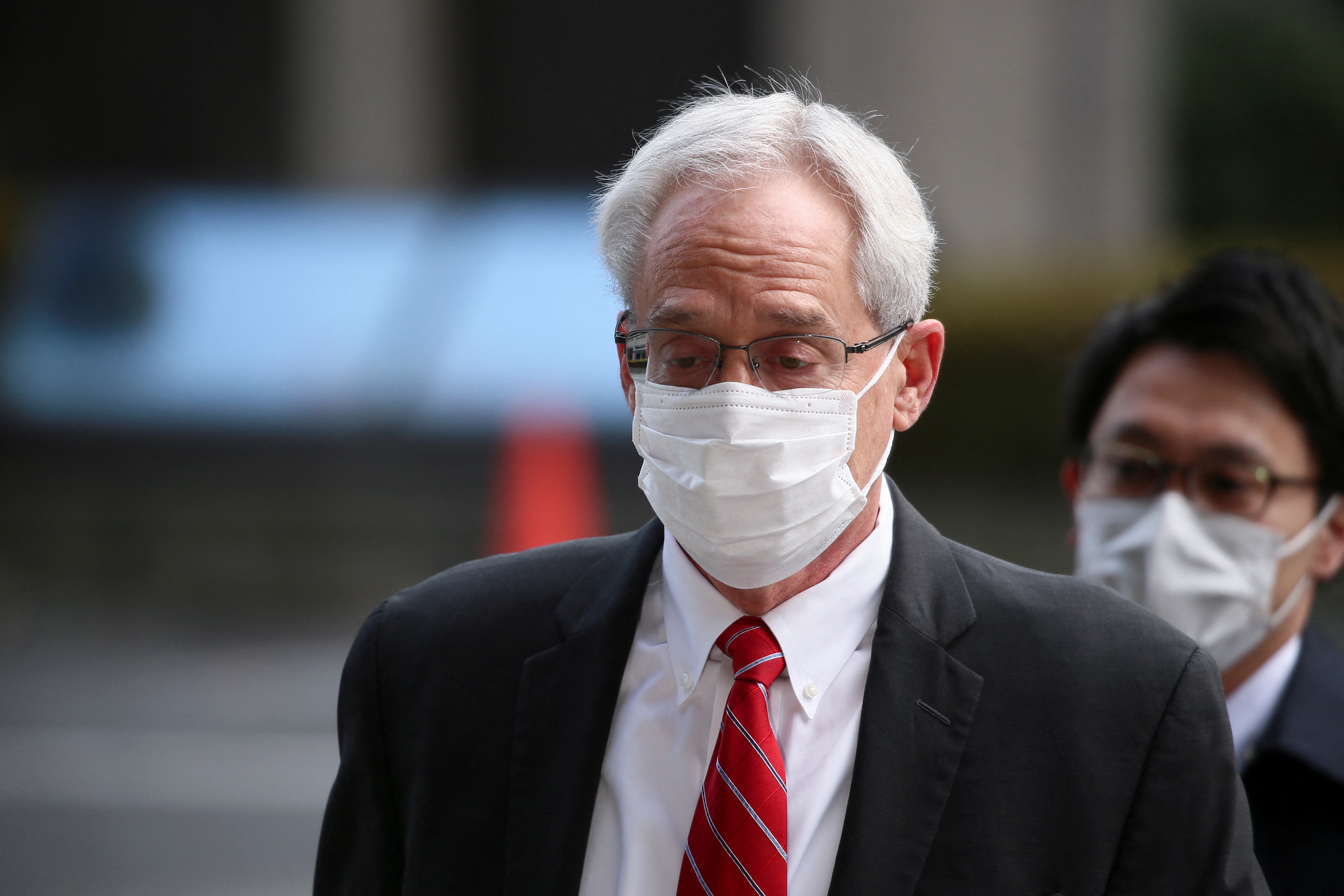 Greg Kelly, former executive of Nissan Motor Co., walks in to the Tokyo District Court