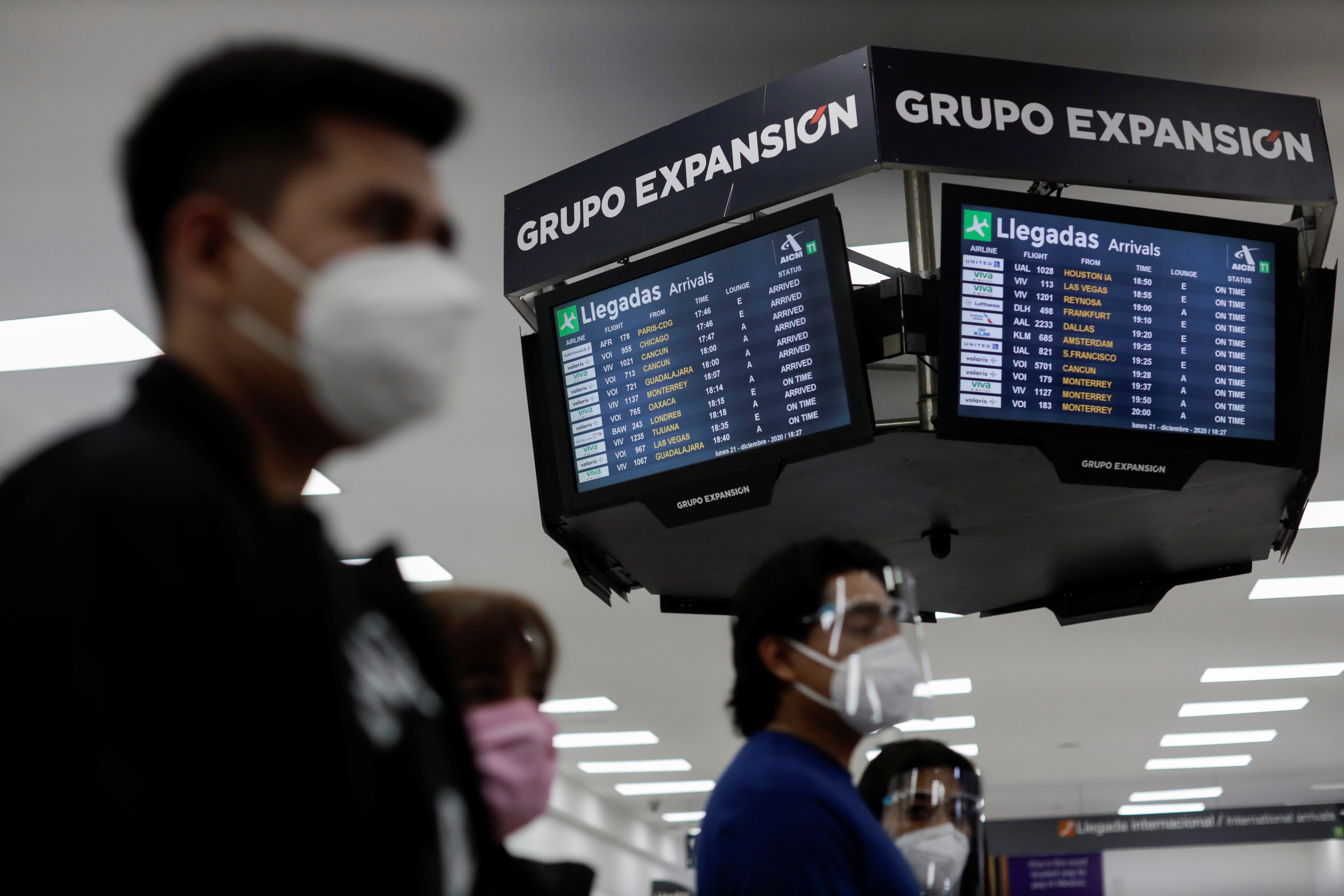 A flight information screen displays the arrivals and delayed flights, including the one from London, as the Mexico's government analyses to suspend flights from the U.K. due to fears about a highly infectious new coronavirus strain amid the coronavirus disease (COVID-19) outbreak, at the Benito Juarez International Airport, in Mexico City, Mexico December 21, 2020. REUTERS/Luis Cortes