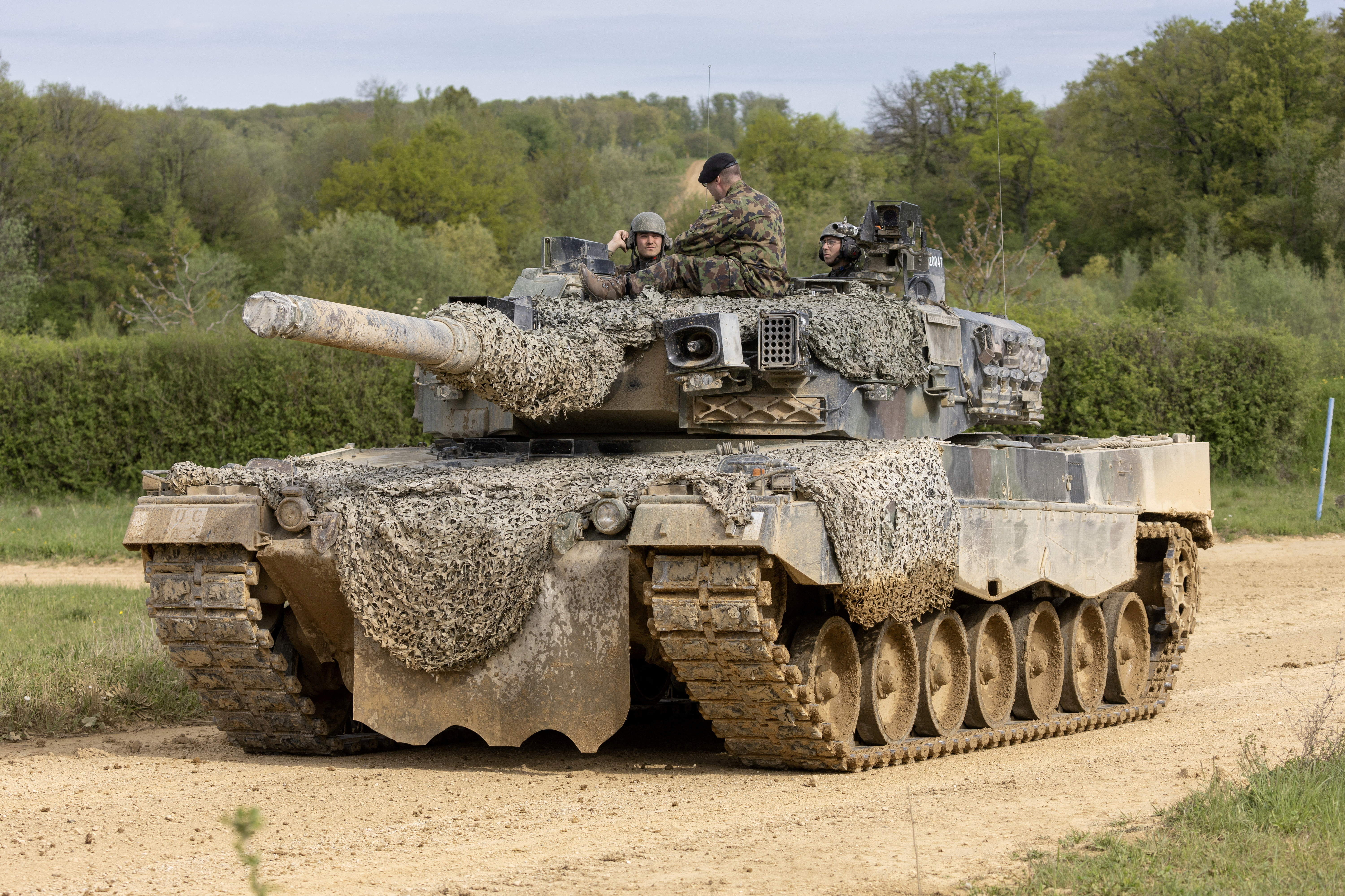 Recruits of the Swiss army Tank School 21 perform an attack exercise with the Leopard 2 tank in Bure