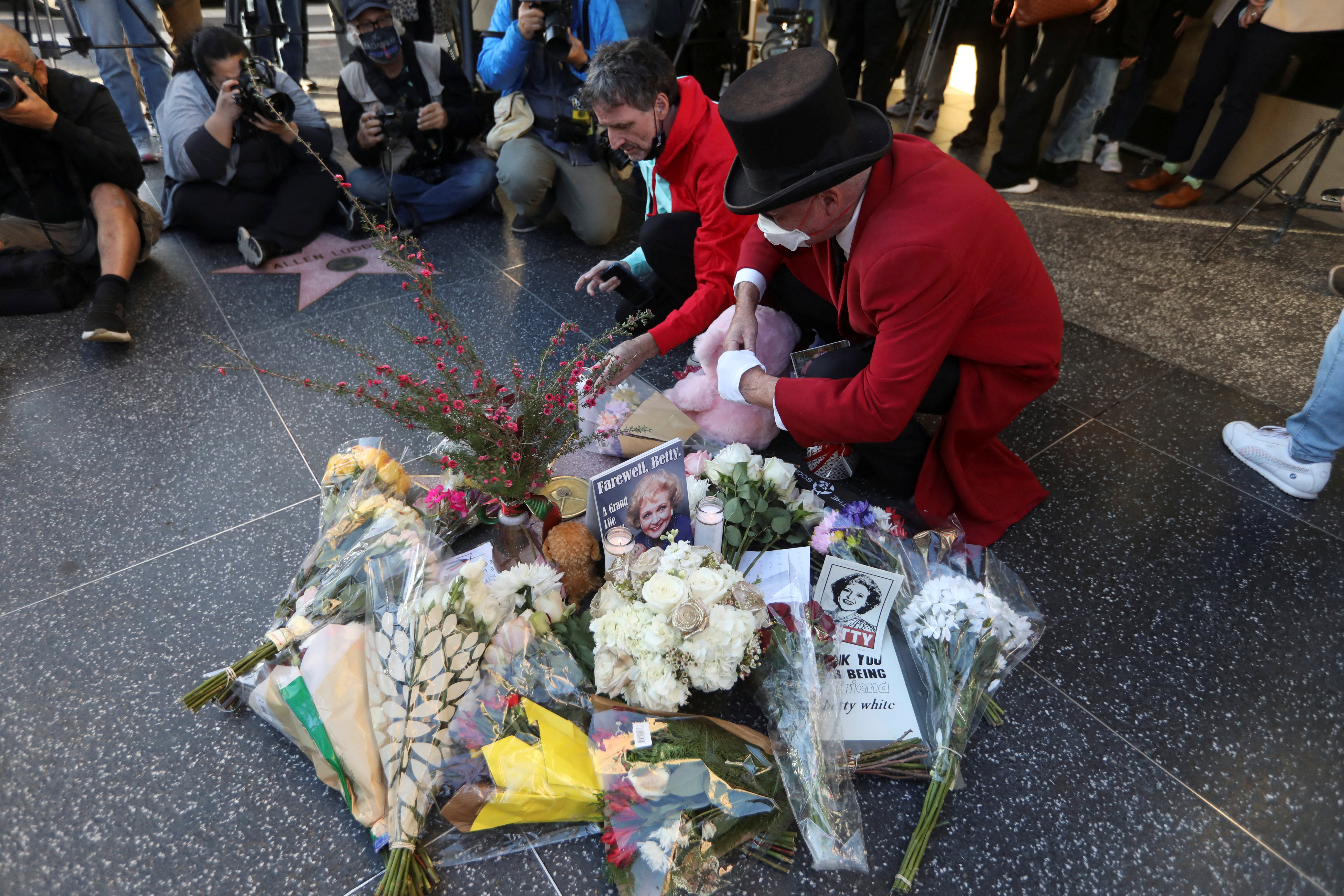 Mourners gather around the Hollywood Walk of Fame star of actor Betty White