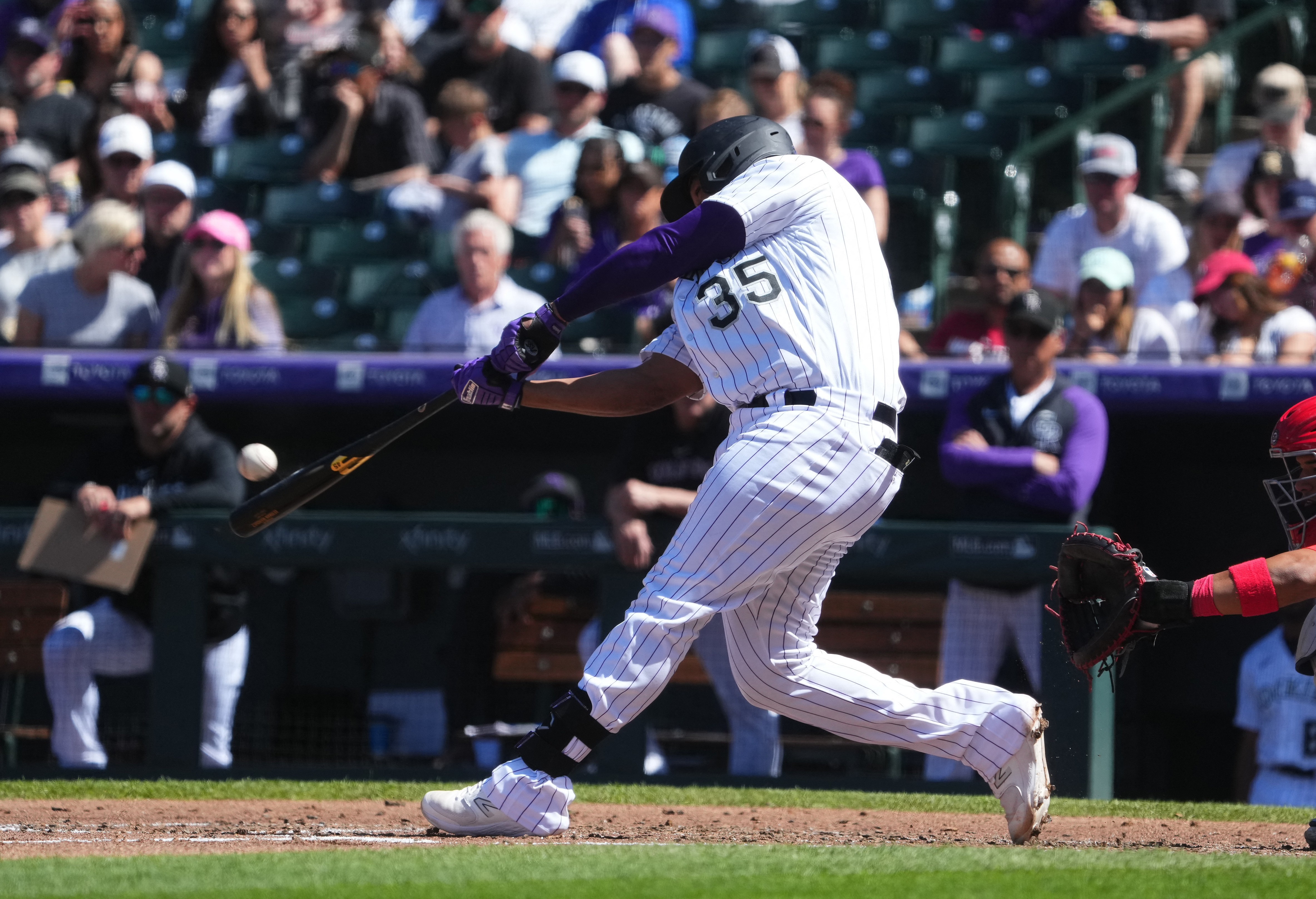 Denver, United States . 17th Aug, 2021. Colorado Rockies catcher Elias Diaz  (35) hits a home run during an MLB regular season game against the San  Diego Padres, Tuesday, August 17, 2021