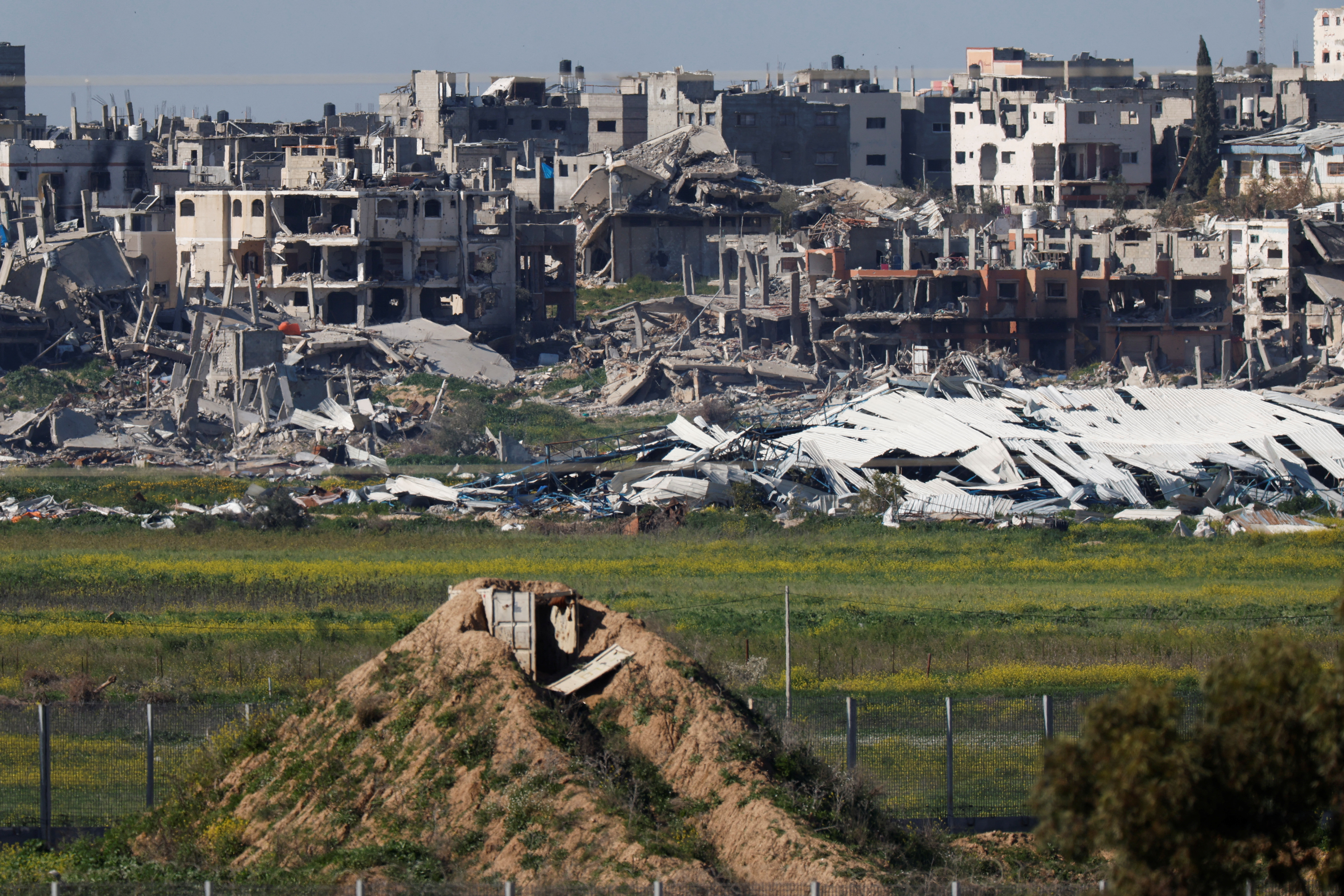 A view of damaged buildings in the Gaza Strip, as seen from southern Israel