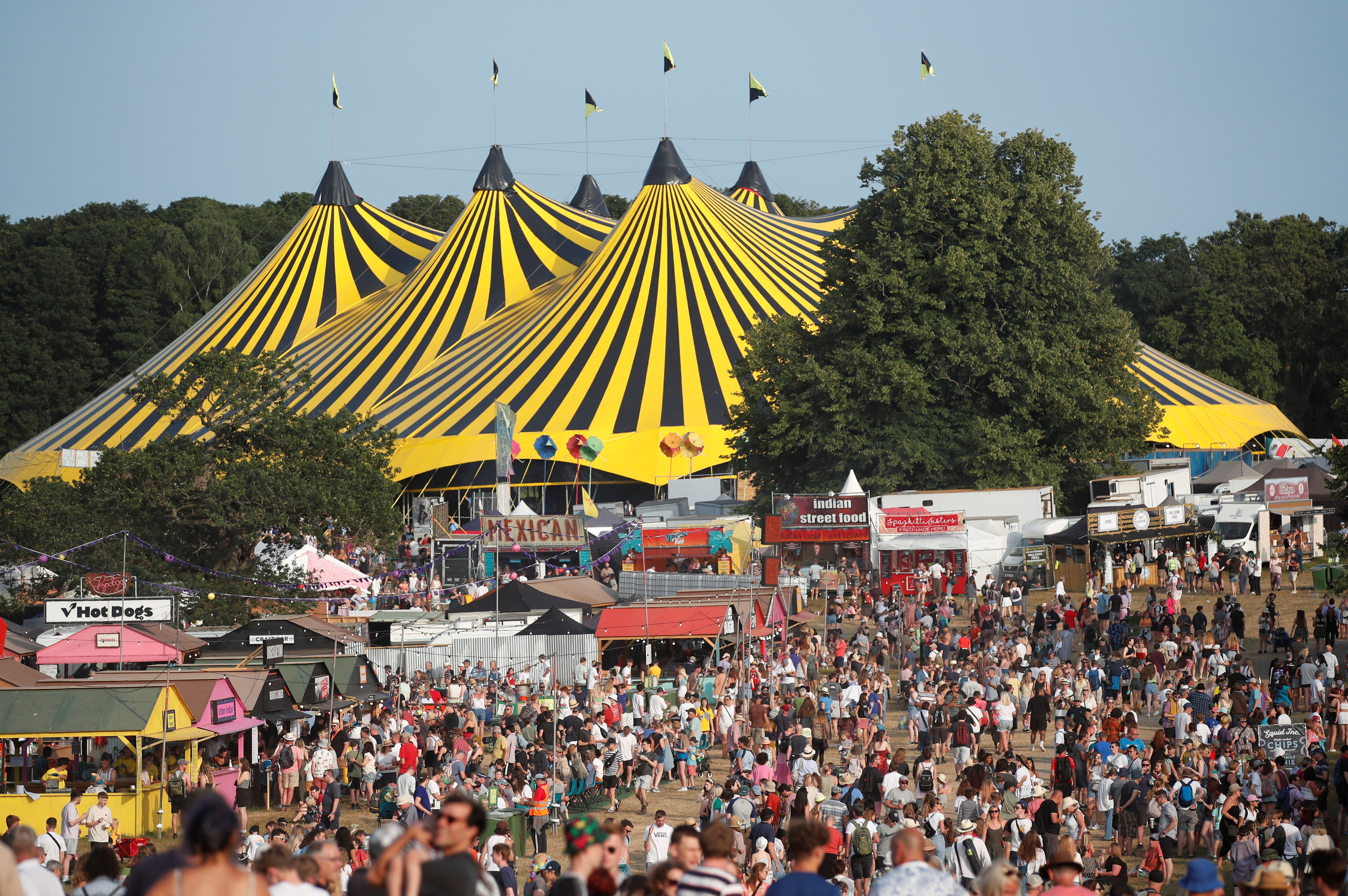 Festivalgoers enjoy the weather and stalls at Latitude Festival at Henham Park