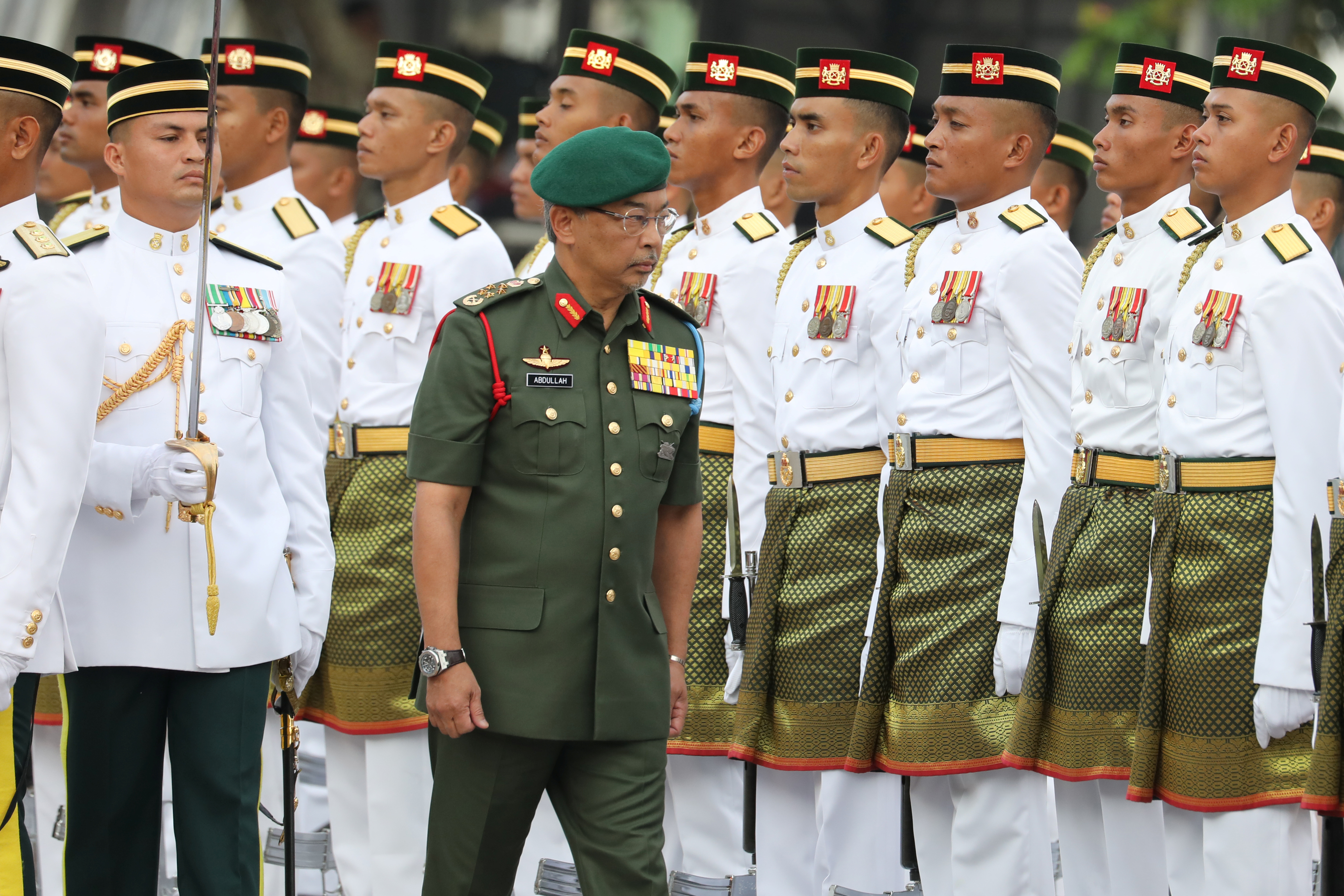 Malaysia's King, Al-Sultan Abdullah Ri'ayatuddin Al-Mustafa Billah Shah, inspects an honour guard during the 62nd Merdeka Day (Independence Day) celebrations in Putrajaya.
