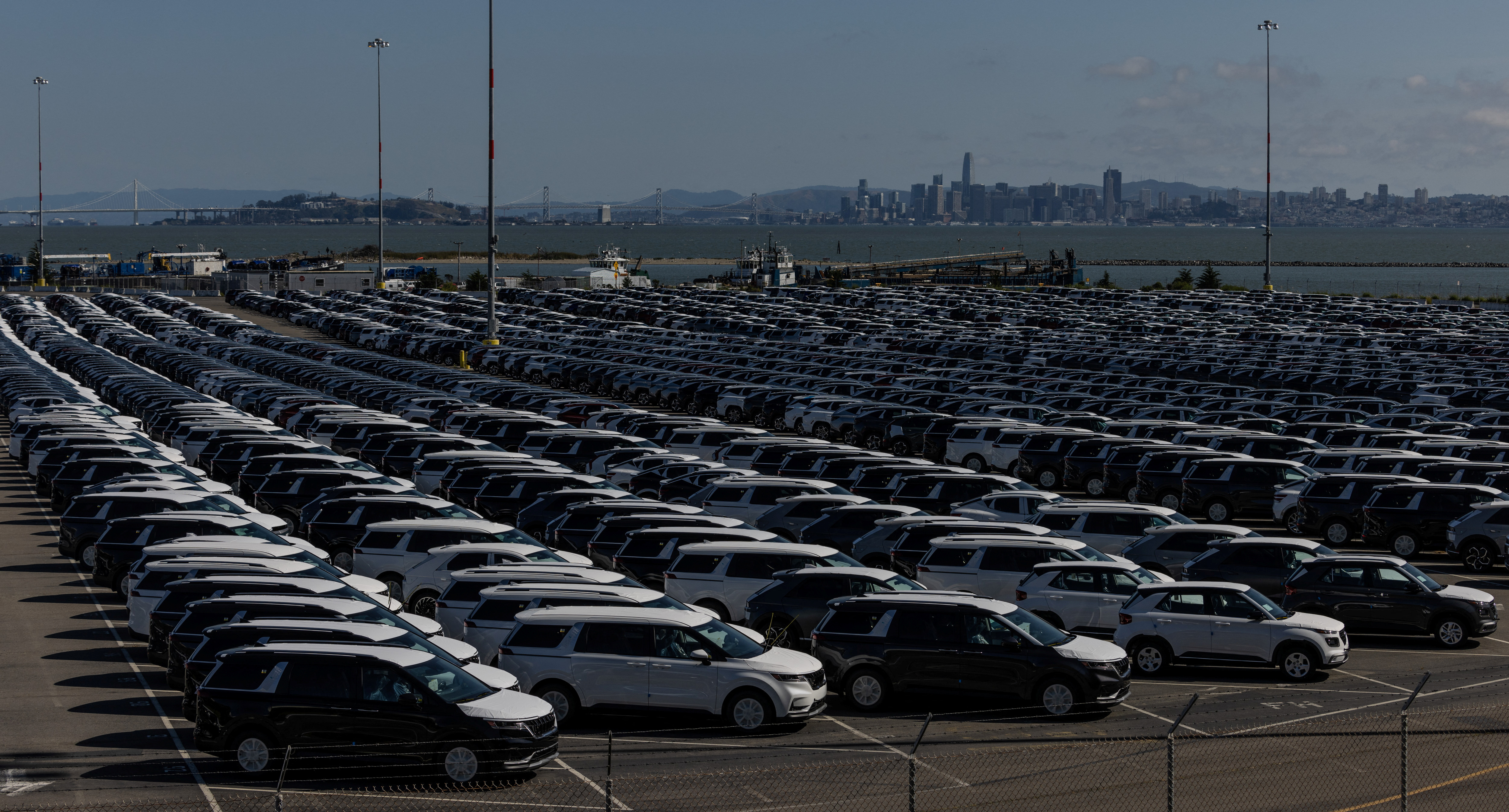 New vehicles are seen at a parking lot in the Port of Richmond, California
