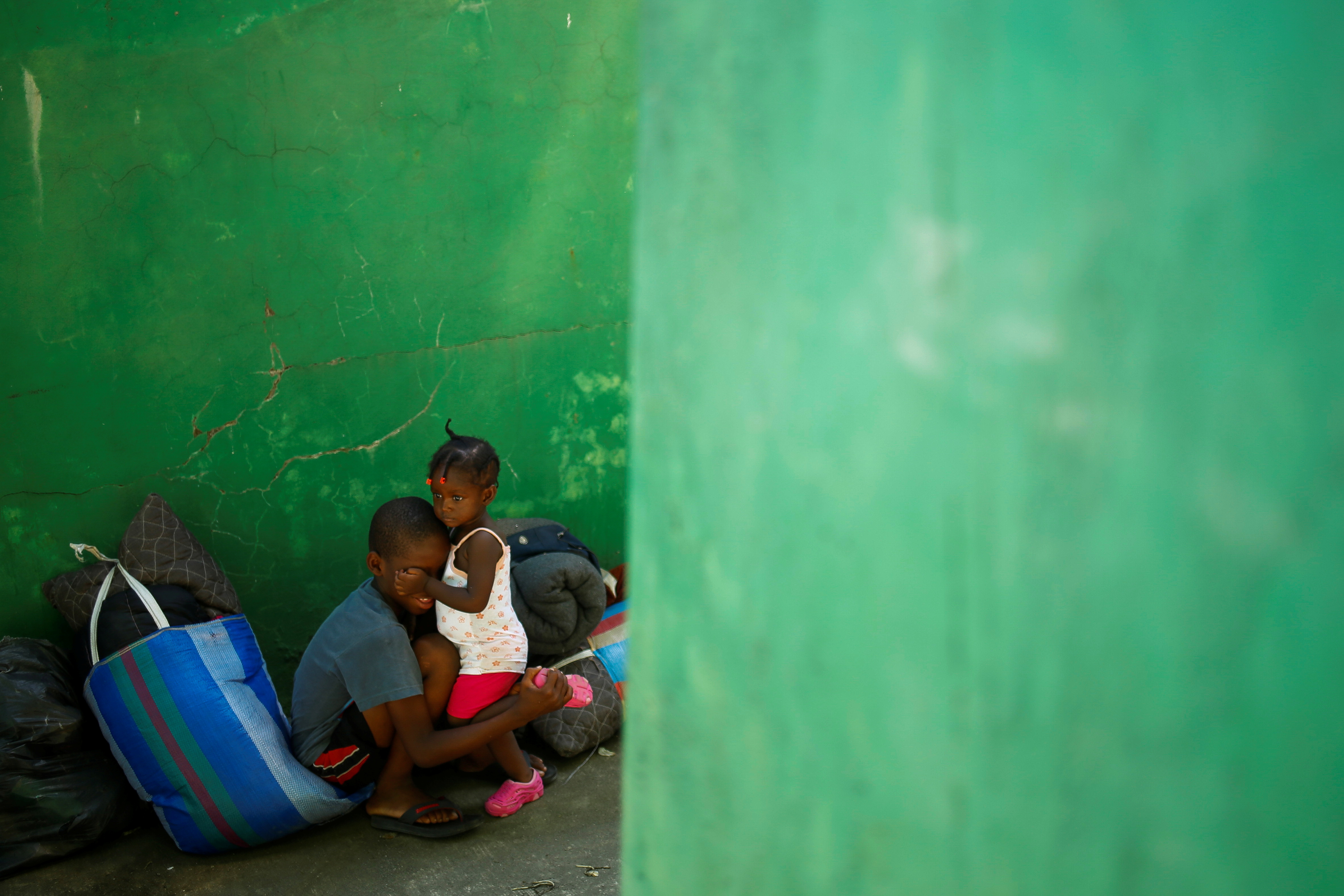 Migrants wait as they hope to obtain humanitarian visas to transit Mexican territory, in Tapachula