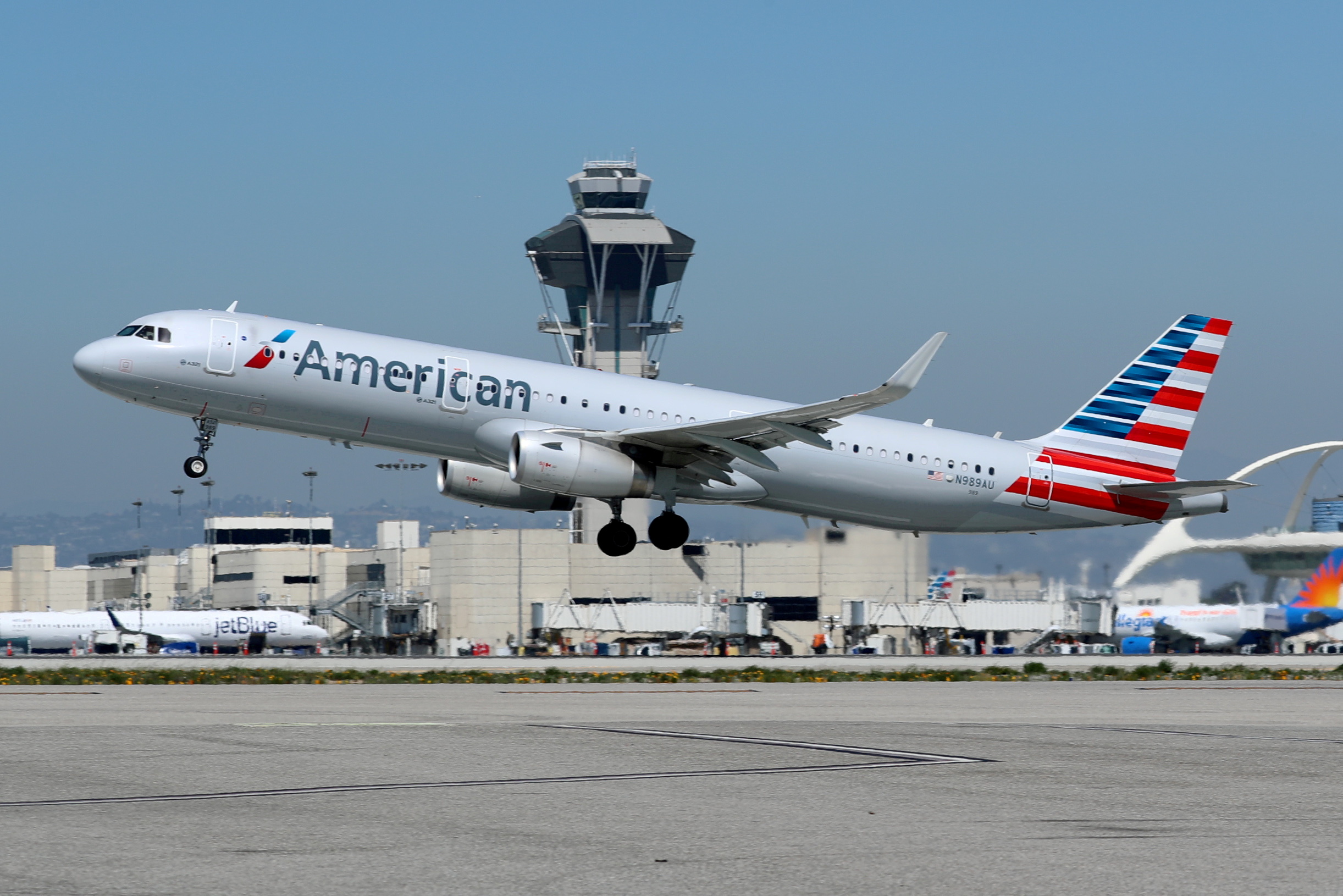 An American Airlines Airbus A321-200 plane takes off from Los Angeles International airport (LAX) in Los Angeles, California, U.S. March 28, 2018. REUTERS/Mike Blake/File Photo