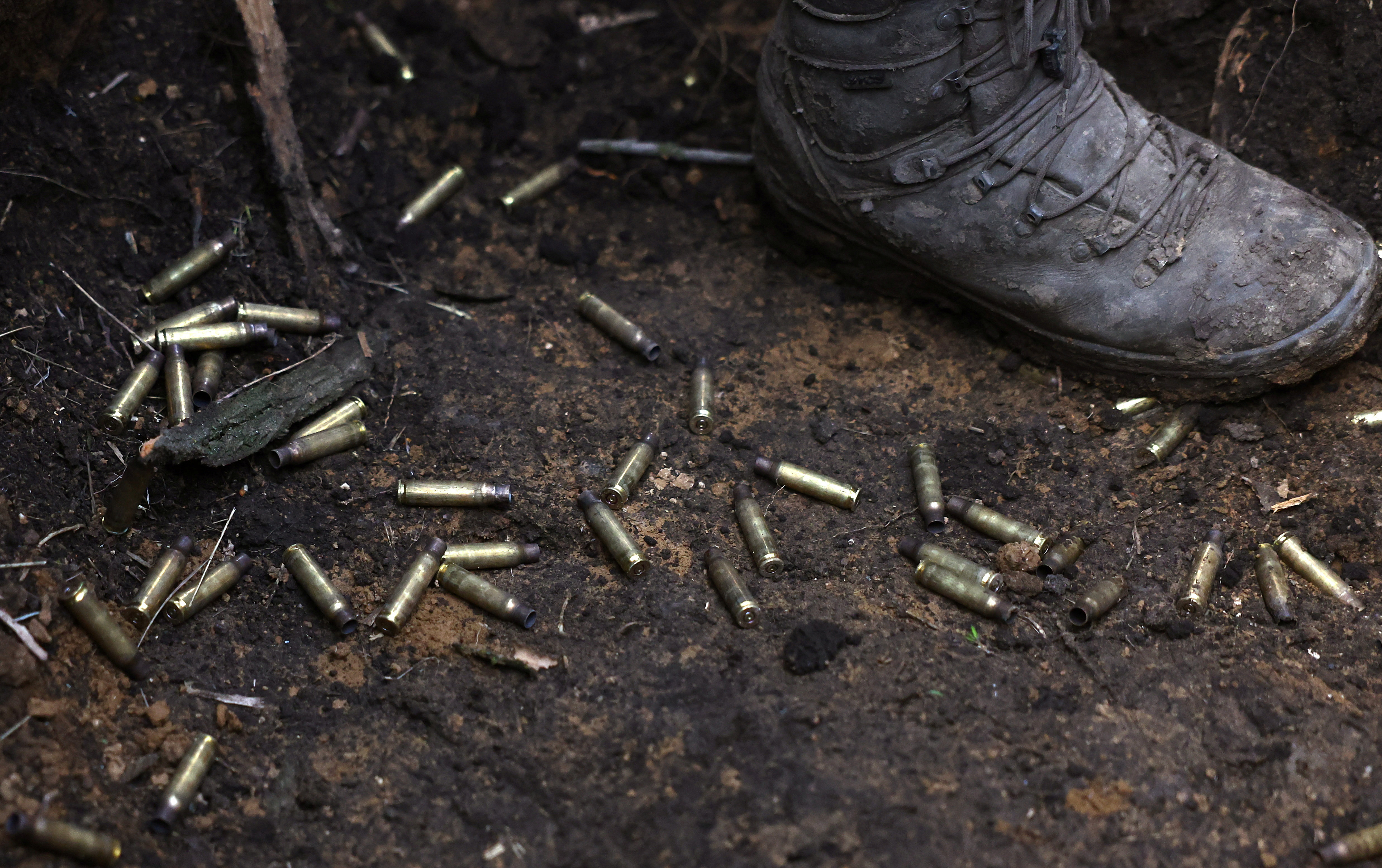 Ukrainian service members operate in the trenches at the frontline in Bakhmut region