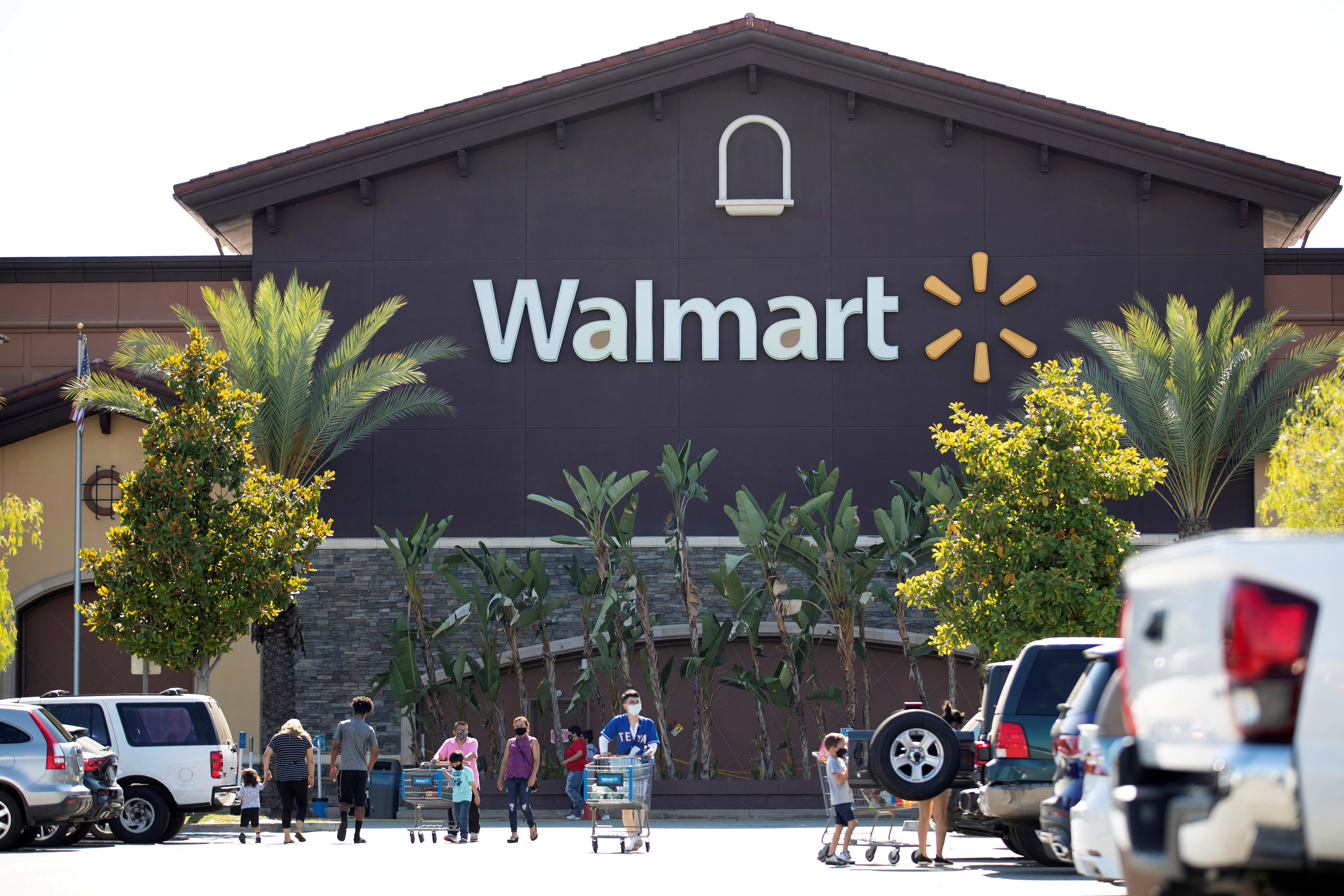 Shoppers wearing face masks are pictured in the parking of a Walmart Superstore during the outbreak of the coronavirus disease (COVID-19), in Rosemead, California, U.S., June 11, 2020. REUTERS/Mario Anzuoni