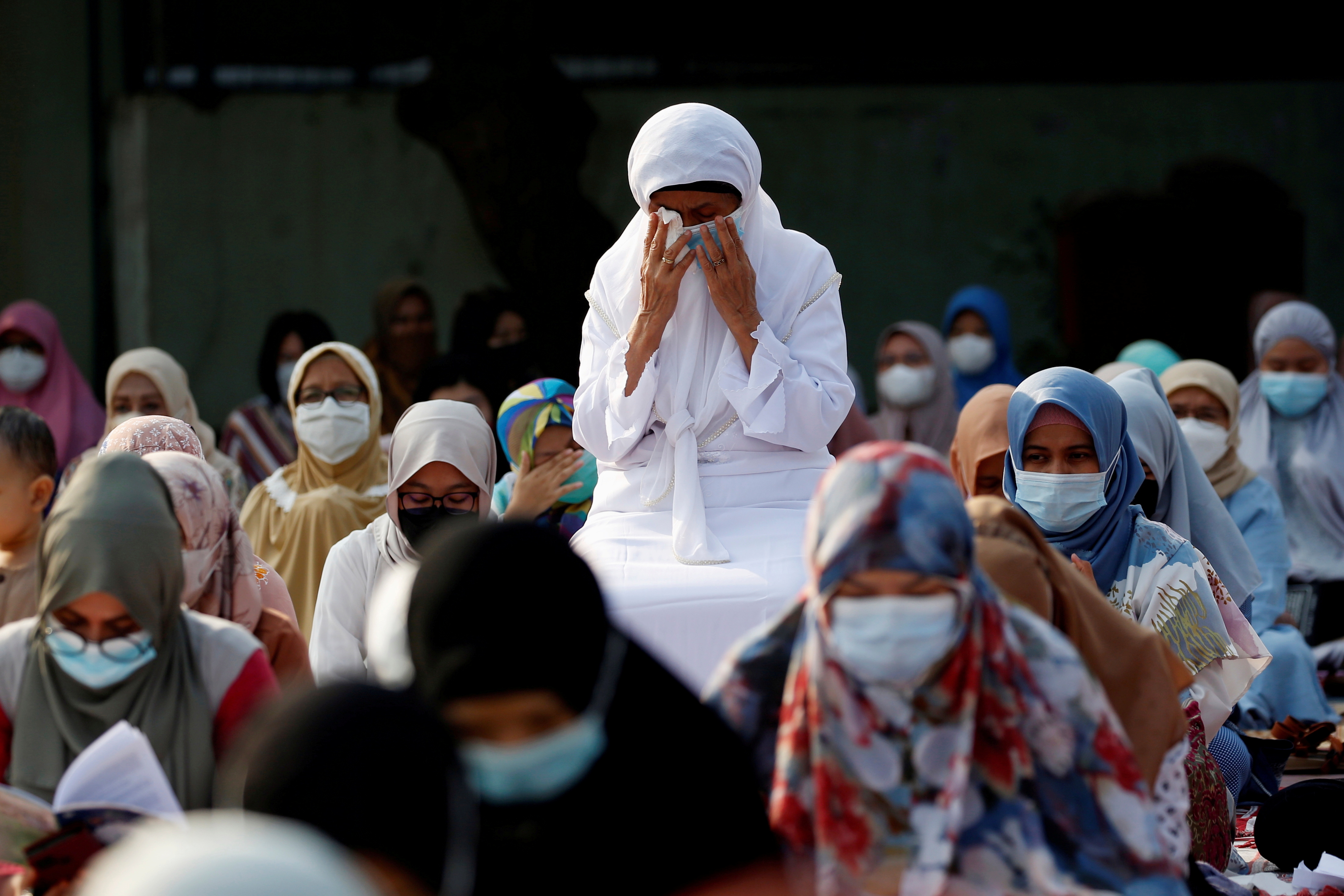 Indonesian Muslims pray at the Great Mosque of Al Azhar during Eid al-Fitr in Jakarta