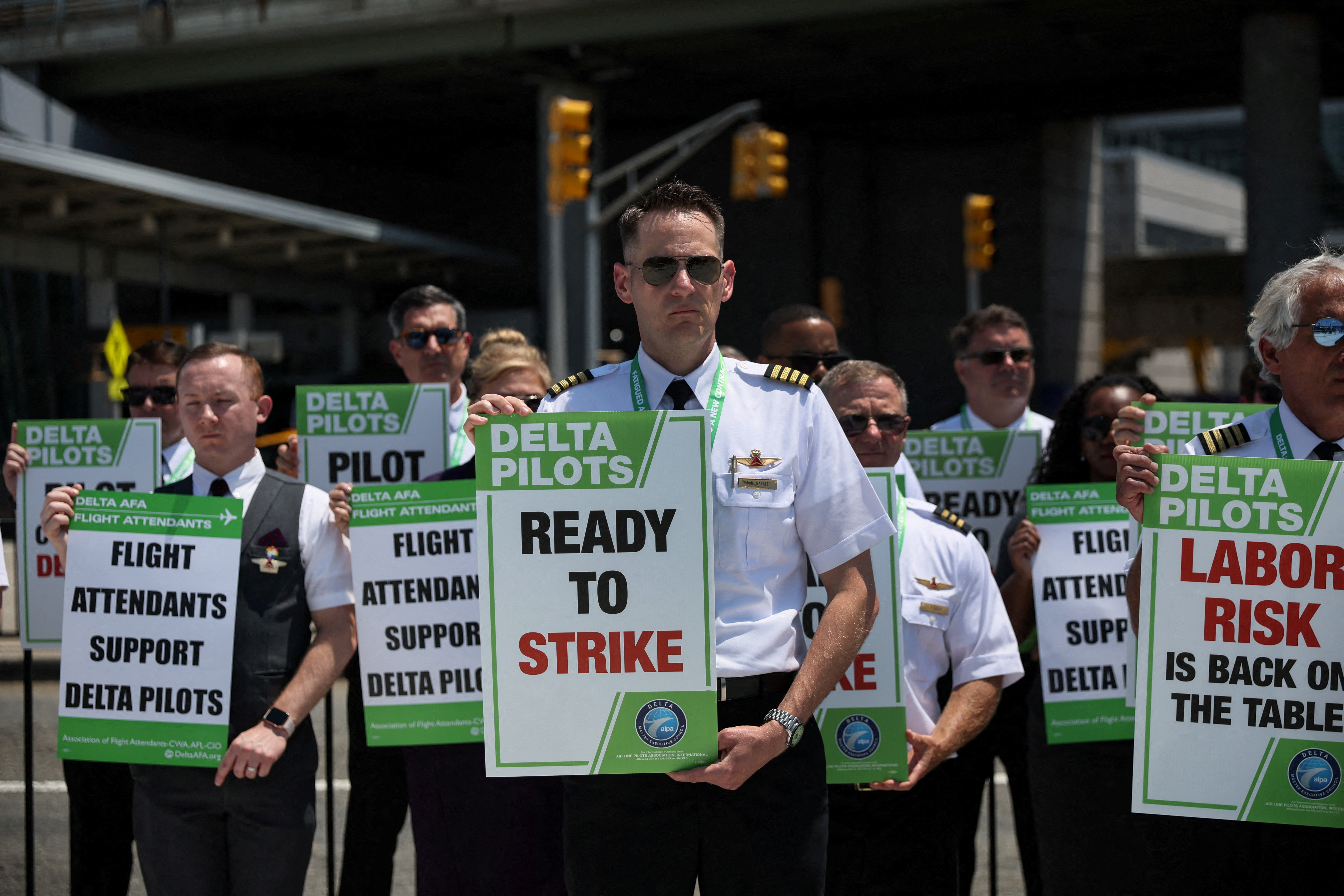 Delta Air Lines pilots, represented by the Air Line Pilots Association, protest outside Terminal 4 at JFK International airport in New York City