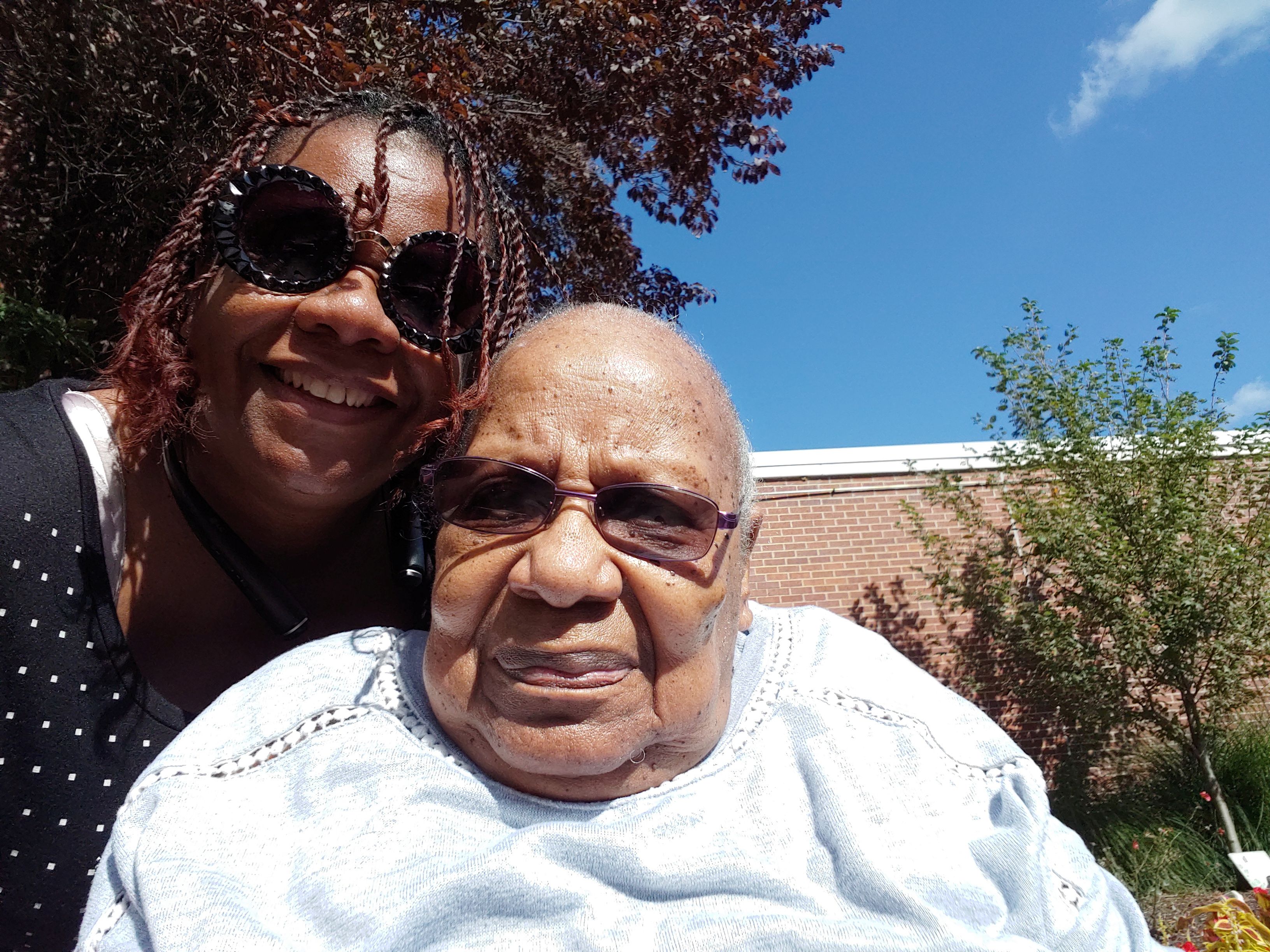 Garnice Robertson poses with her mother Georgia Mae Clardy at a nursing facility in Kansas City