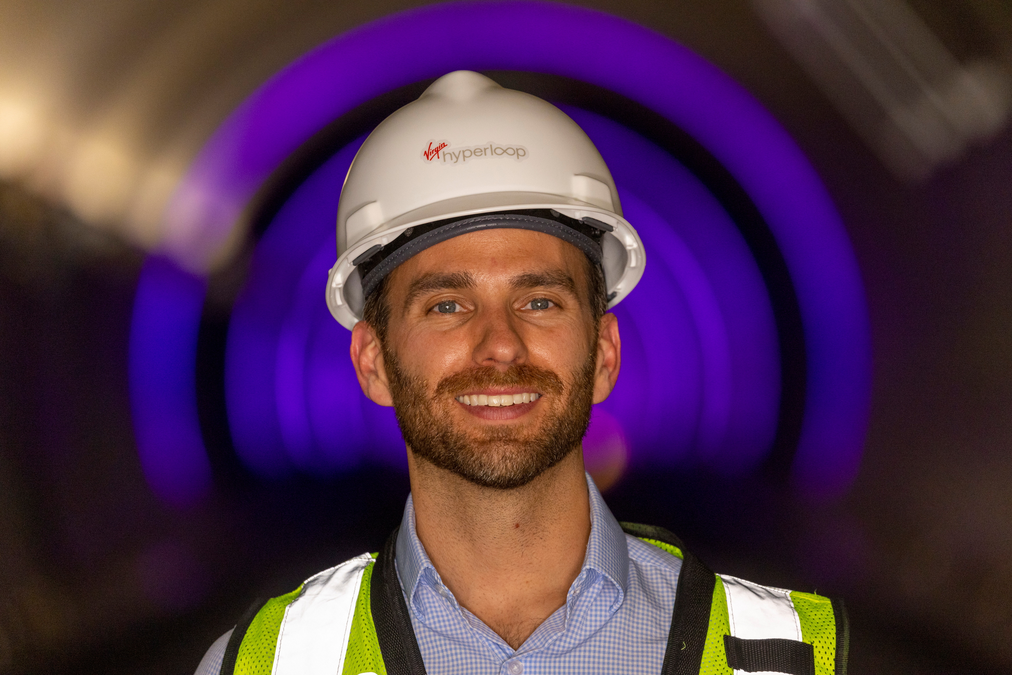 Josh Giegel, co-founder and CEO of Virgin Hyperloop, poses inside a hyperloop tube at the company's hyperloop facility near Las Vegas