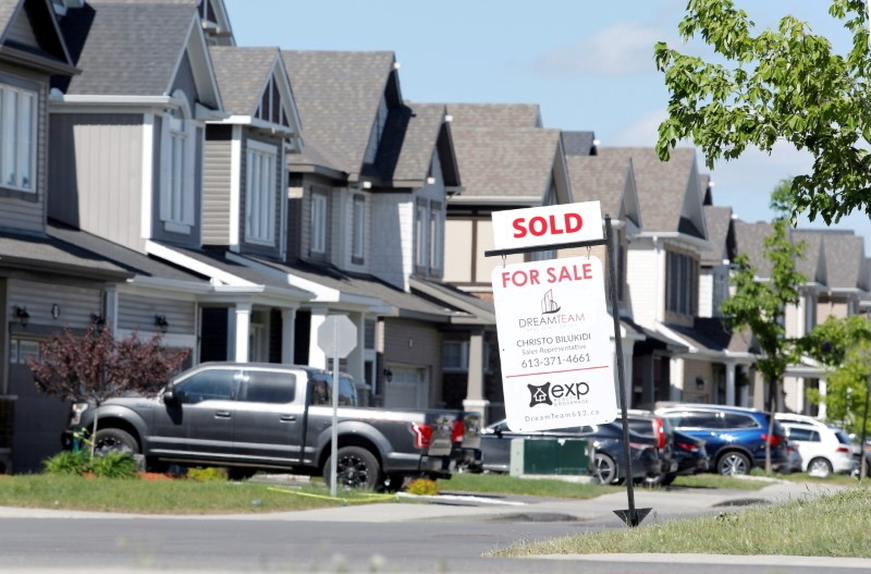 FILE PHOTO: A realtor's 'sold' sign stands outside a house in Ottawa, Ontario, Canada