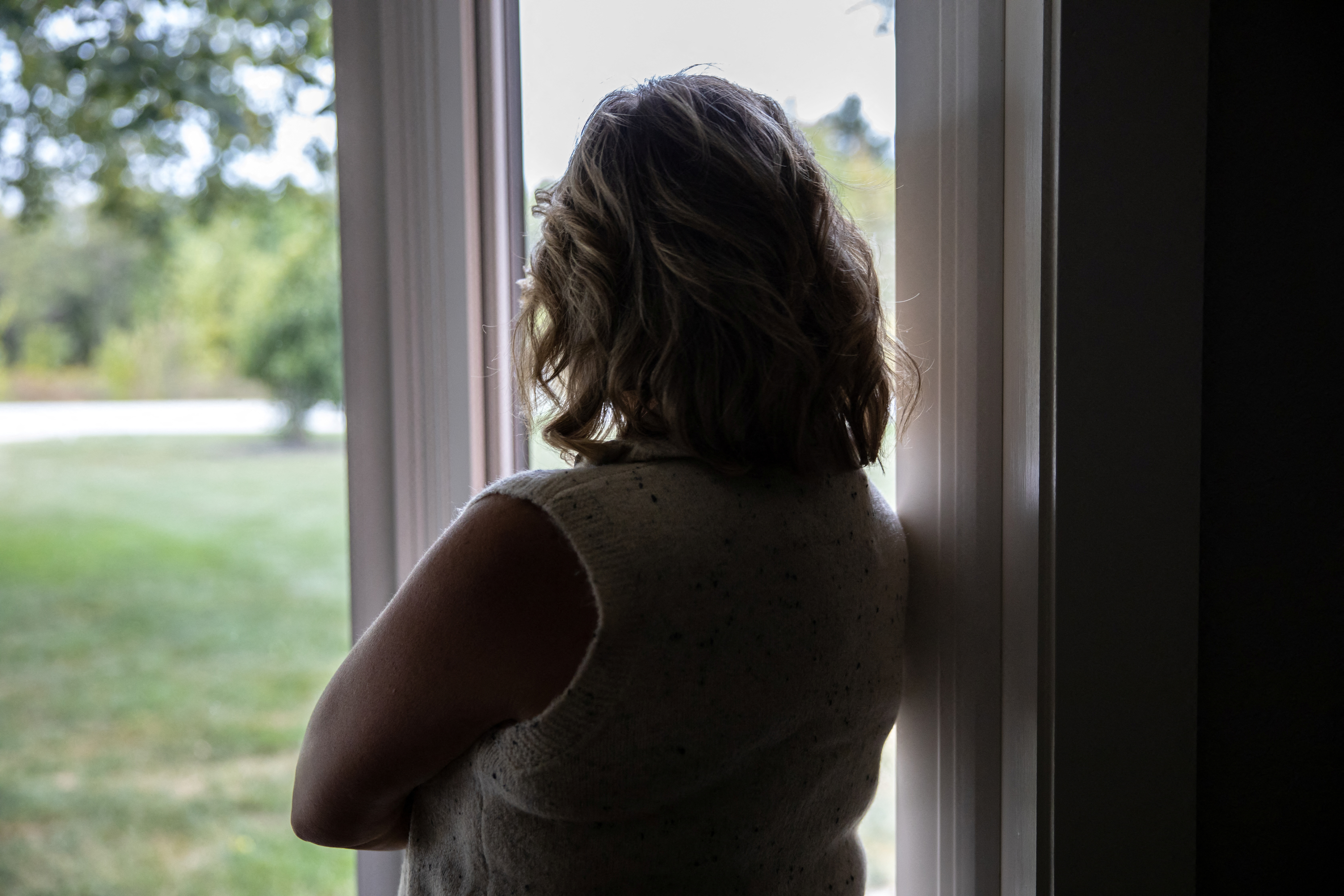 Dawn Heidlebaugh looks out of the window of her home in Findlay